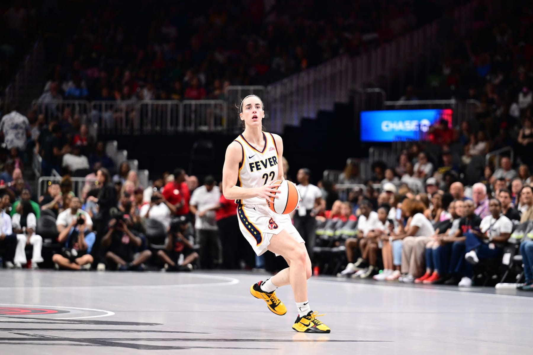 ATLANTA, GA - JUNE 21: Caitlin Clark #22 of the Indiana Fever handles the ball during the game against the Atlanta Dream on June 21, 2024 at Gateway Center Arena in College Park, Georgia. NOTE TO USER: User expressly acknowledges and agrees that, by downloading and or using this photograph, User is consenting to the terms and conditions of the Getty Images License Agreement. Mandatory Copyright Notice: Copyright 2024 NBAE (Photo by Adam Hagy/NBAE via Getty Images)