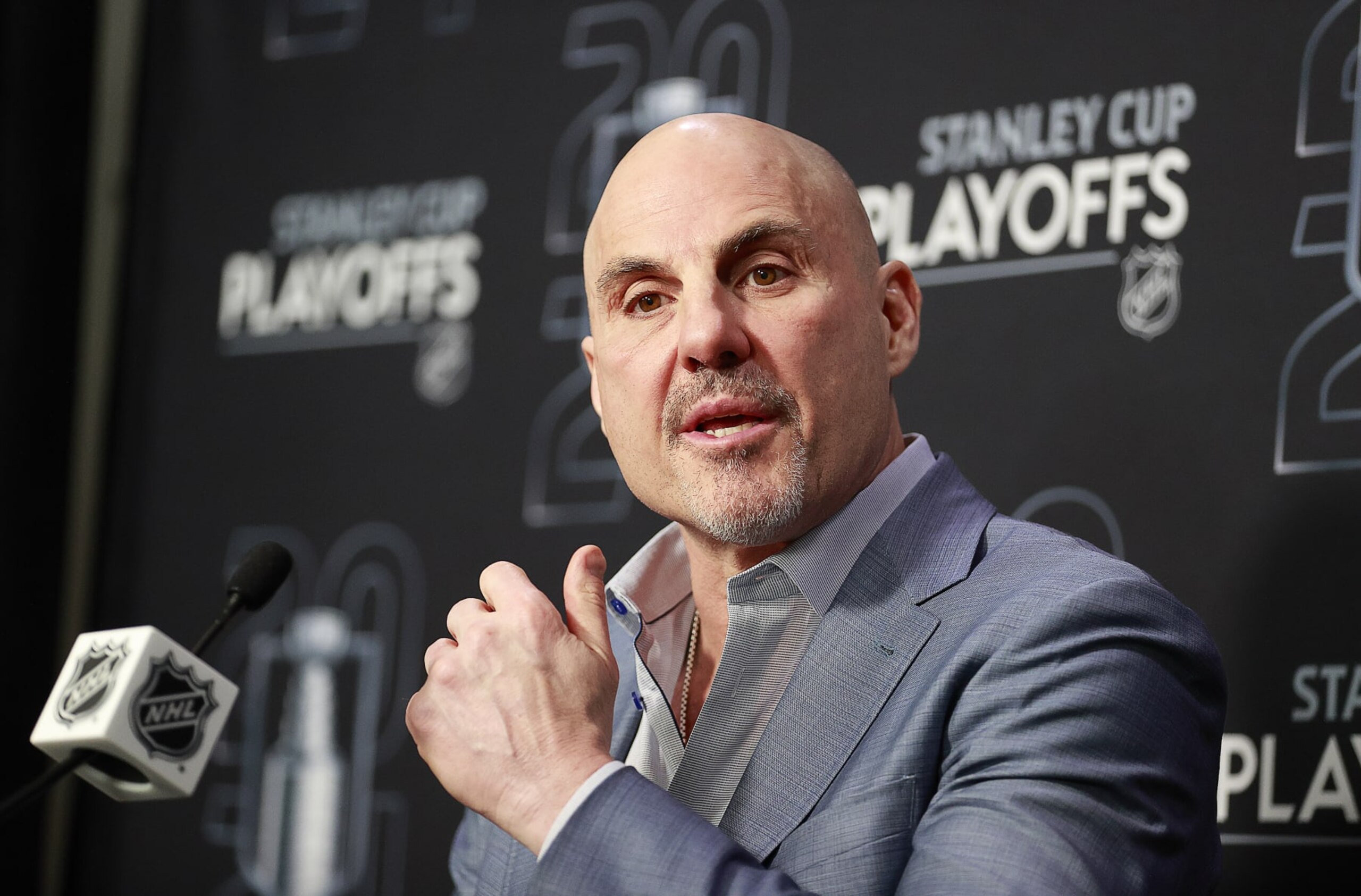 VANCOUVER, CANADA - MAY 20: Head coach Rick Tocchet of the Vancouver Canucks talks during a press conference at the end of Game Seven of the Second Round of the 2024 Stanley Cup Playoffs against the Edmonton Oilers at Rogers Arena on May 20, 2024 in Vancouver, British Columbia, Canada. Edmonton won 3-2 and take the series 4-3. (Photo by Jeff Vinnick/NHLI via Getty Images) VANCOUVER, CANADA - MAY 20: Head coach Rick Tocchet of the Vancouver Canucks talks during a press conference at the end of Game Seven of the Second Round of the 2024 Stanley Cup Playoffs against the Edmonton Oilers at Rogers Arena on May 20, 2024 in Vancouver, British Columbia, Canada. Edmonton won 3-2 and take the series 4-3. (Photo by Jeff Vinnick/NHLI via Getty Images)
