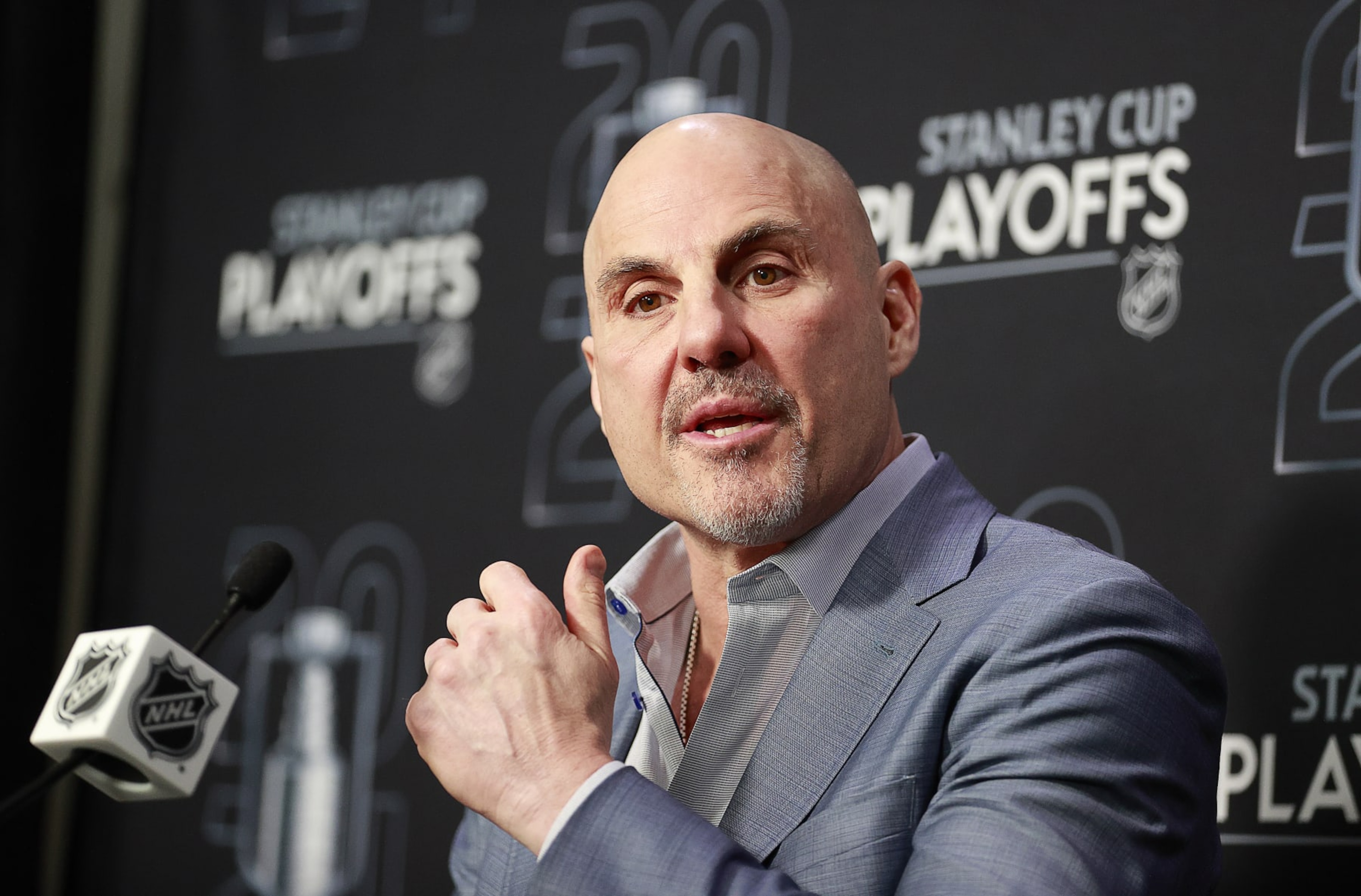 VANCOUVER, CANADA - MAY 20: Head coach Rick Tocchet of the Vancouver Canucks talks during a press conference at the end of Game Seven of the Second Round of the 2024 Stanley Cup Playoffs against the Edmonton Oilers at Rogers Arena on May 20, 2024 in Vancouver, British Columbia, Canada. Edmonton won 3-2 and take the series 4-3. (Photo by Jeff Vinnick/NHLI via Getty Images) VANCOUVER, CANADA - MAY 20: Head coach Rick Tocchet of the Vancouver Canucks talks during a press conference at the end of Game Seven of the Second Round of the 2024 Stanley Cup Playoffs against the Edmonton Oilers at Rogers Arena on May 20, 2024 in Vancouver, British Columbia, Canada. Edmonton won 3-2 and take the series 4-3. (Photo by Jeff Vinnick/NHLI via Getty Images)