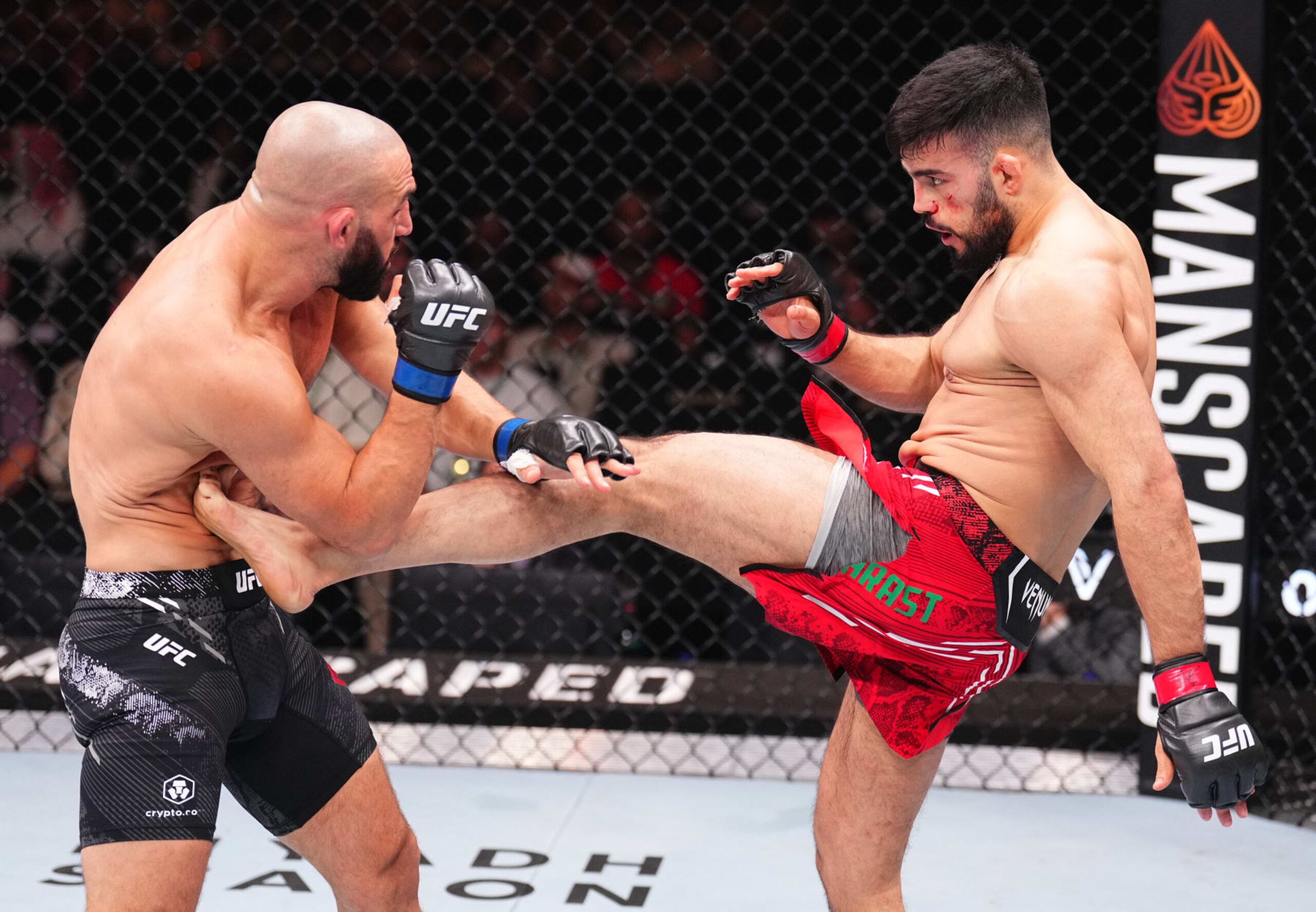 RIYADH, SAUDI ARABIA - JUNE 22: (R-L) Nasrat Haqparast of Germany kicks Jared Gordon in a lightweight fight during the UFC Fight Night event at Kingdom Arena on June 22, 2024 in Riyadh, Saudi Arabia. (Photo by Chris Unger/Zuffa LLC via Getty Images) RIYADH, SAUDI ARABIA - JUNE 22: (R-L) Nasrat Haqparast of Germany kicks Jared Gordon in a lightweight fight during the UFC Fight Night event at Kingdom Arena on June 22, 2024 in Riyadh, Saudi Arabia. (Photo by Chris Unger/Zuffa LLC via Getty Images)