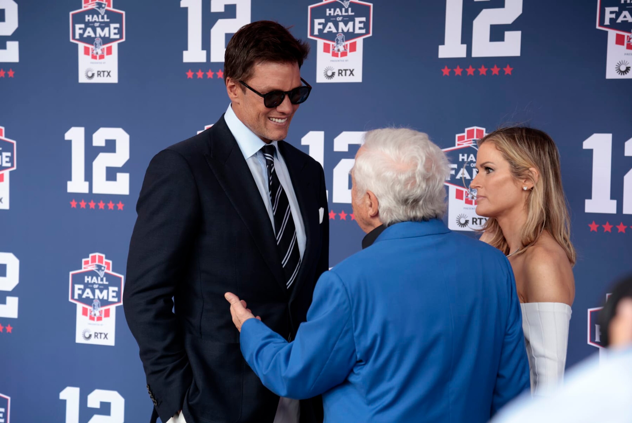 FOXBOROUGH, MA - JUNE 12: Tom Brady, New England Patriots chairman and CEO Robert Kraft and his wife Dana Blumberg during the induction of Tom Brady into the New England Patriots Hall of Fame on June 12, 2024 at Gillette Stadium in Foxborough, Massachusetts. (Photo by Fred Kfoury III/Icon Sportswire via Getty Images)