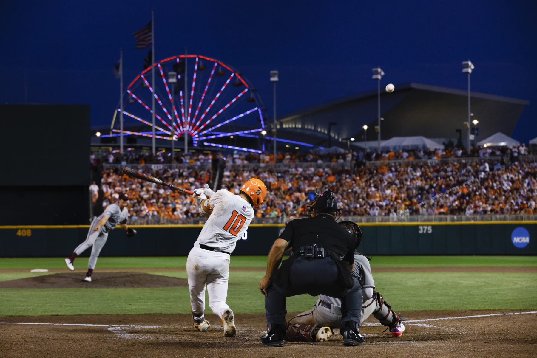 OMAHA, NEBRASKA - JUNE 22: Cal Stark #10 of the Tennessee Volunteers hits against the Texas A&M Aggies during the Division I Men's Baseball Championship held at Charles Schwab Field on June 22, 2024 in Omaha, Nebraska.  (Photo by C. Morgan Engel/NCAA Photos via Getty Images)