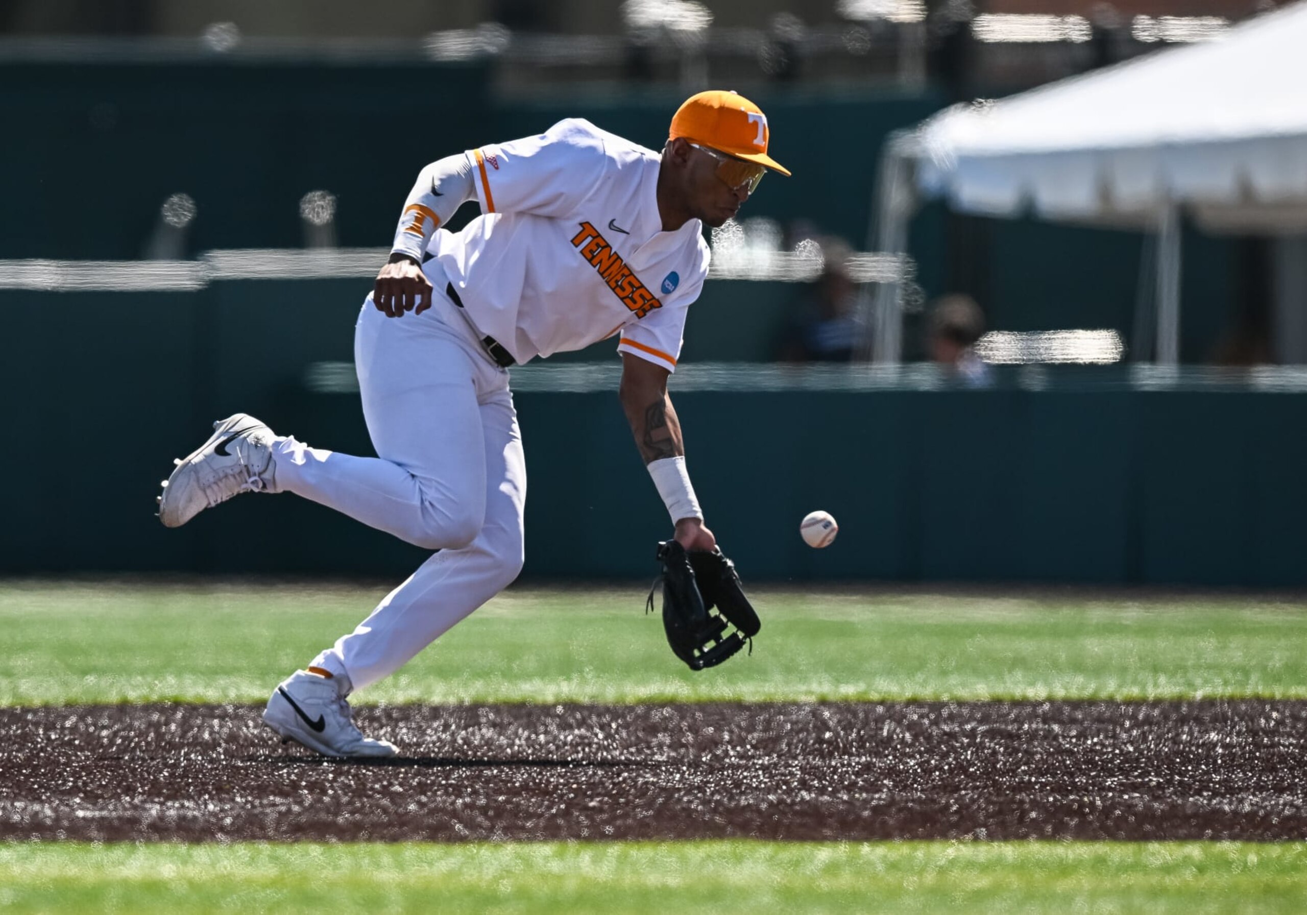 KNOXVILLE, TN - JUNE 07: Tennessee infielder Christian Moore (1) fields a ball during the NCAA Men's Baseball Super Regional game between the Tennessee Volunteers and the Evansville Aces on June 7, 2024, at Lindsey Nelson Stadium in Knoxville, TN. (Photo by Bryan Lynn/Icon Sportswire via Getty Images) KNOXVILLE, TN - JUNE 07: Tennessee infielder Christian Moore (1) fields a ball during the NCAA Men's Baseball Super Regional game between the Tennessee Volunteers and the Evansville Aces on June 7, 2024, at Lindsey Nelson Stadium in Knoxville, TN. (Photo by Bryan Lynn/Icon Sportswire via Getty Images)
