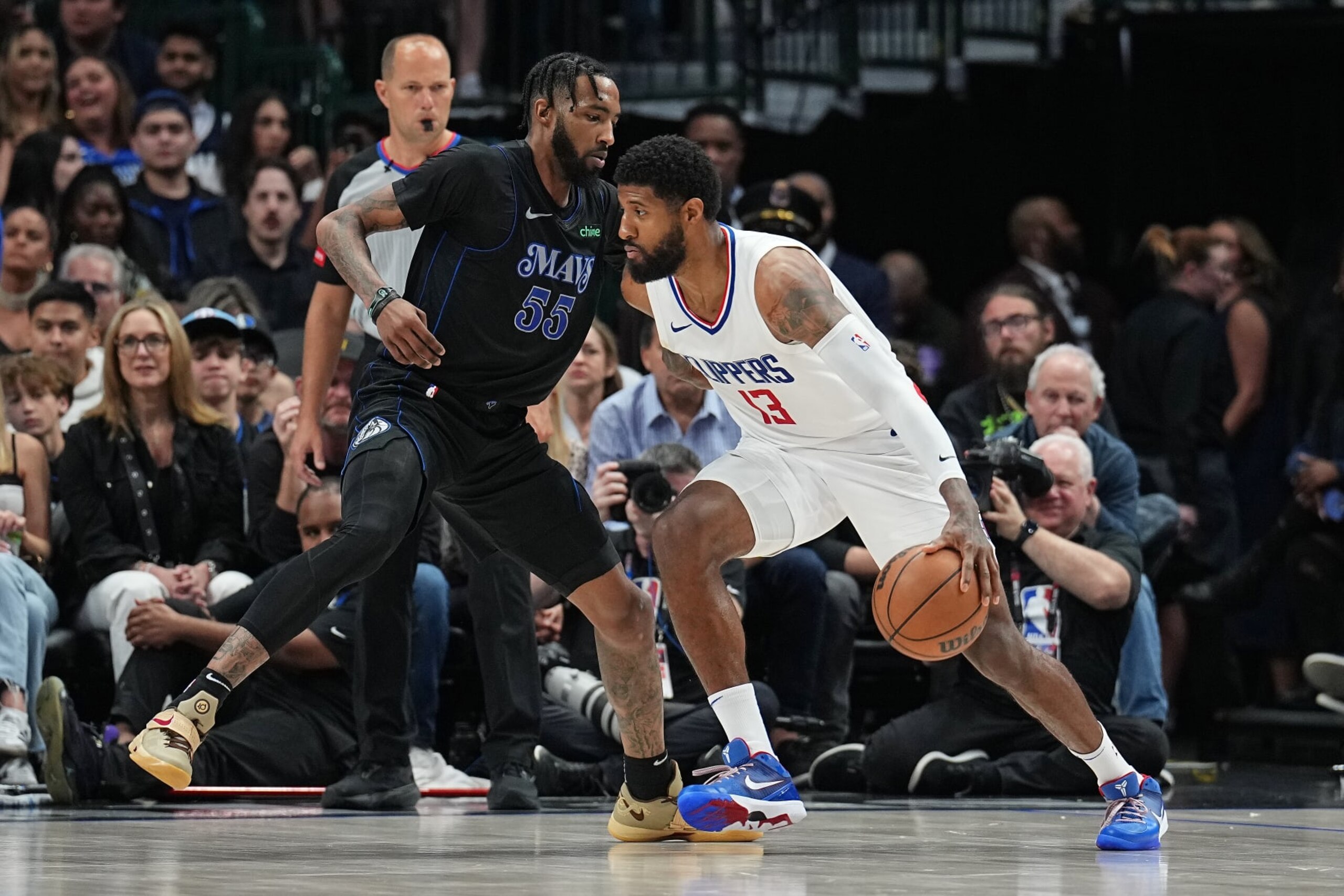DALLAS, TX - MAY 3: Paul George #13 of the LA Clippers handles the ball during the game against the Dallas Mavericks during Round 1 Game 6 of the 2024 NBA Playoffs on May 3, 2024 at the American Airlines Center in Dallas, Texas. NOTE TO USER: User expressly acknowledges and agrees that, by downloading and or using this photograph, User is consenting to the terms and conditions of the Getty Images License Agreement. Mandatory Copyright Notice: Copyright 2024 NBAE (Photo by Glenn James/NBAE via Getty Images) DALLAS, TX - MAY 3: Paul George #13 of the LA Clippers handles the ball during the game against the Dallas Mavericks during Round 1 Game 6 of the 2024 NBA Playoffs on May 3, 2024 at the American Airlines Center in Dallas, Texas. NOTE TO USER: User expressly acknowledges and agrees that, by downloading and or using this photograph, User is consenting to the terms and conditions of the Getty Images License Agreement. Mandatory Copyright Notice: Copyright 2024 NBAE (Photo by Glenn James/NBAE via Getty Images)