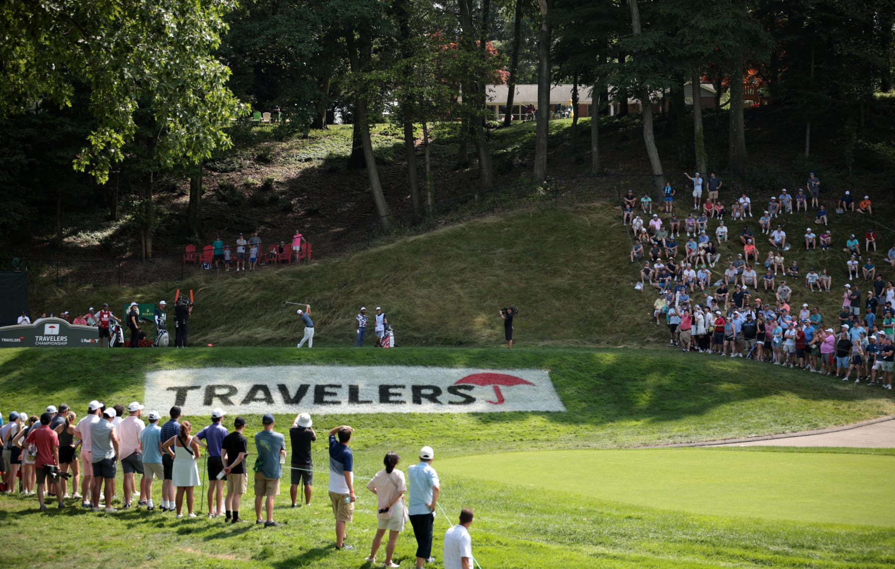 CROMWELL, CONNECTICUT - JUNE 23: Tom Kim of South Korea plays his shot from the 15th tee during the final round of the Travelers Championship at TPC River Highlands on June 23, 2024 in Cromwell, Connecticut. (Photo by James Gilbert/Getty Images)