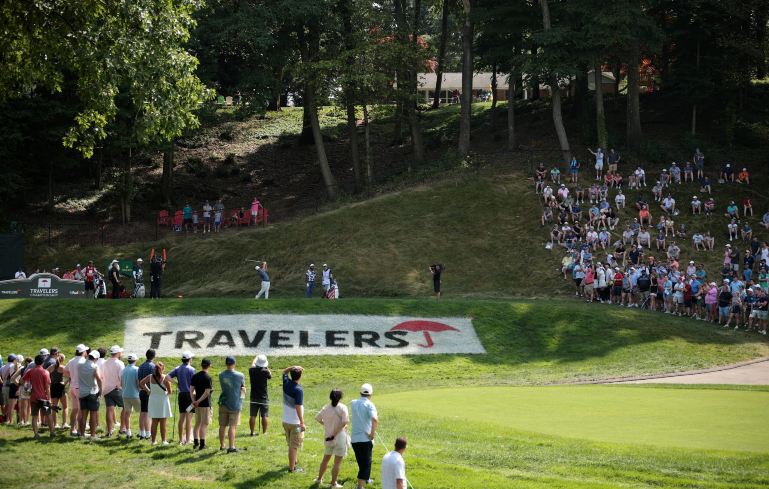 CROMWELL, CONNECTICUT - JUNE 23: Tom Kim of South Korea plays his shot from the 15th tee during the final round of the Travelers Championship at TPC River Highlands on June 23, 2024 in Cromwell, Connecticut. (Photo by James Gilbert/Getty Images)