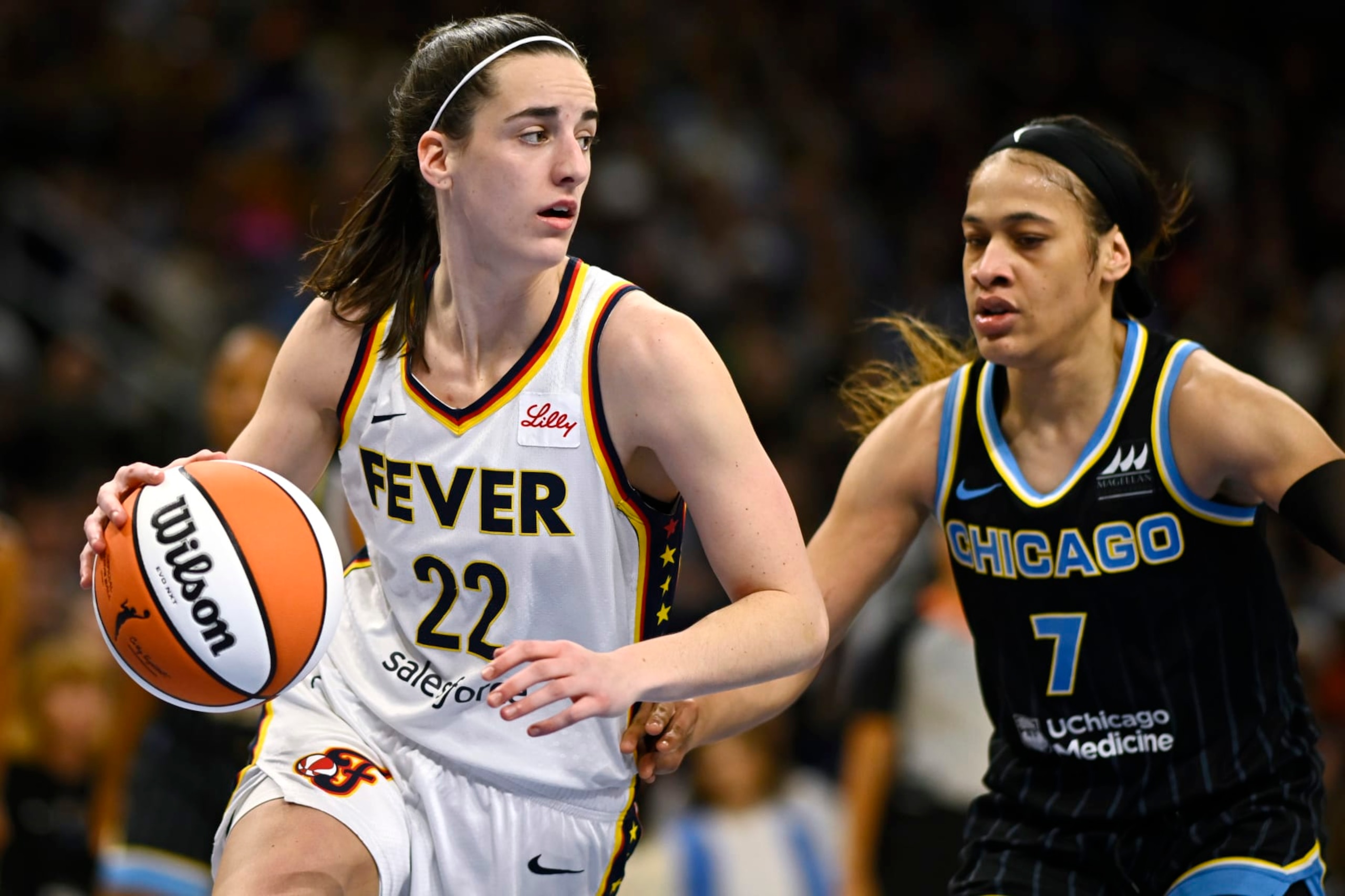 CHICAGO, ILLINOIS - JUNE 23: Caitlin Clark #22 of the Indiana Fever drives in the second half against Chennedy Carter #7 of the Chicago Sky at Wintrust Arena on June 23, 2024 in Chicago, Illinois. NOTE TO USER: User expressly acknowledges and agrees that, by downloading and or using this photograph, User is consenting to the terms and conditions of the Getty Images License Agreement. (Photo by Quinn Harris/Getty Images) CHICAGO, ILLINOIS - JUNE 23: Caitlin Clark #22 of the Indiana Fever drives in the second half against Chennedy Carter #7 of the Chicago Sky at Wintrust Arena on June 23, 2024 in Chicago, Illinois. NOTE TO USER: User expressly acknowledges and agrees that, by downloading and or using this photograph, User is consenting to the terms and conditions of the Getty Images License Agreement. (Photo by Quinn Harris/Getty Images)