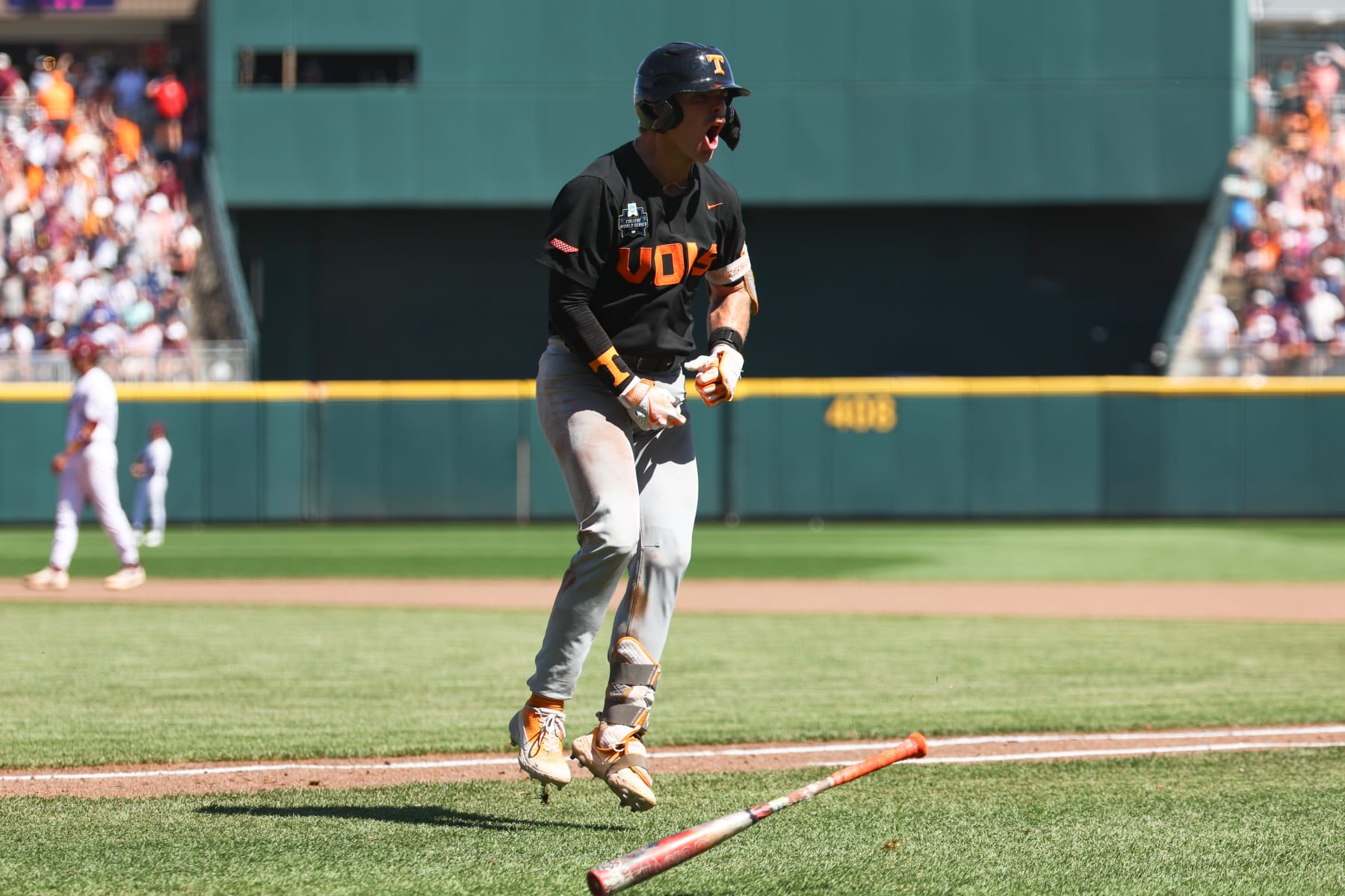 OMAHA, NEBRASKA - JUNE 23: Cal Stark #10 of the Tennessee Volunteers reacts after hitting a home run against the Texas A&M Aggies in the eighth inning of game two of the Division I Men's Baseball Championship held at Charles Schwab Field on June 23, 2024 in Omaha, Nebraska.  (Photo by Jamie Schwaberow/NCAA Photos via Getty Images)
