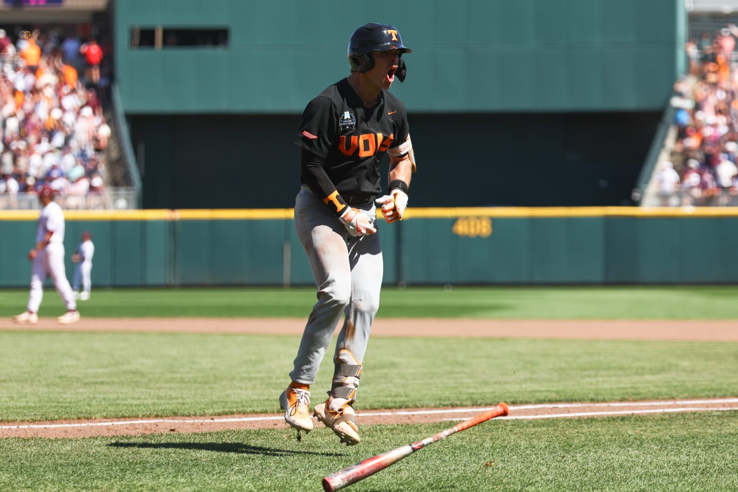OMAHA, NEBRASKA - JUNE 23: Cal Stark #10 of the Tennessee Volunteers reacts after hitting a home run against the Texas A&M Aggies in the eighth inning of game two of the Division I Men's Baseball Championship held at Charles Schwab Field on June 23, 2024 in Omaha, Nebraska.  (Photo by Jamie Schwaberow/NCAA Photos via Getty Images)