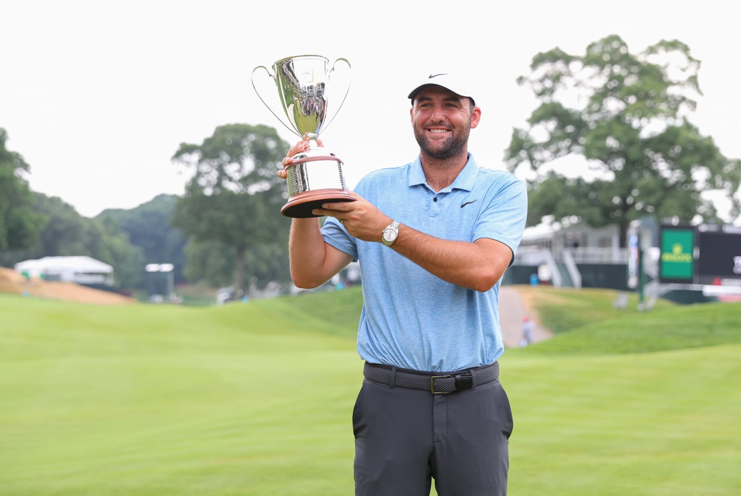 CROMWELL, CT - JUNE 23: Scottie Scheffler of United States pose for pictures after winning the 2024 Travelers Championship on June 23, 2024, at TPC River Highlands in Cromwell, CT. (Photo by M. Anthony Nesmith/Icon Sportswire via Getty Images)