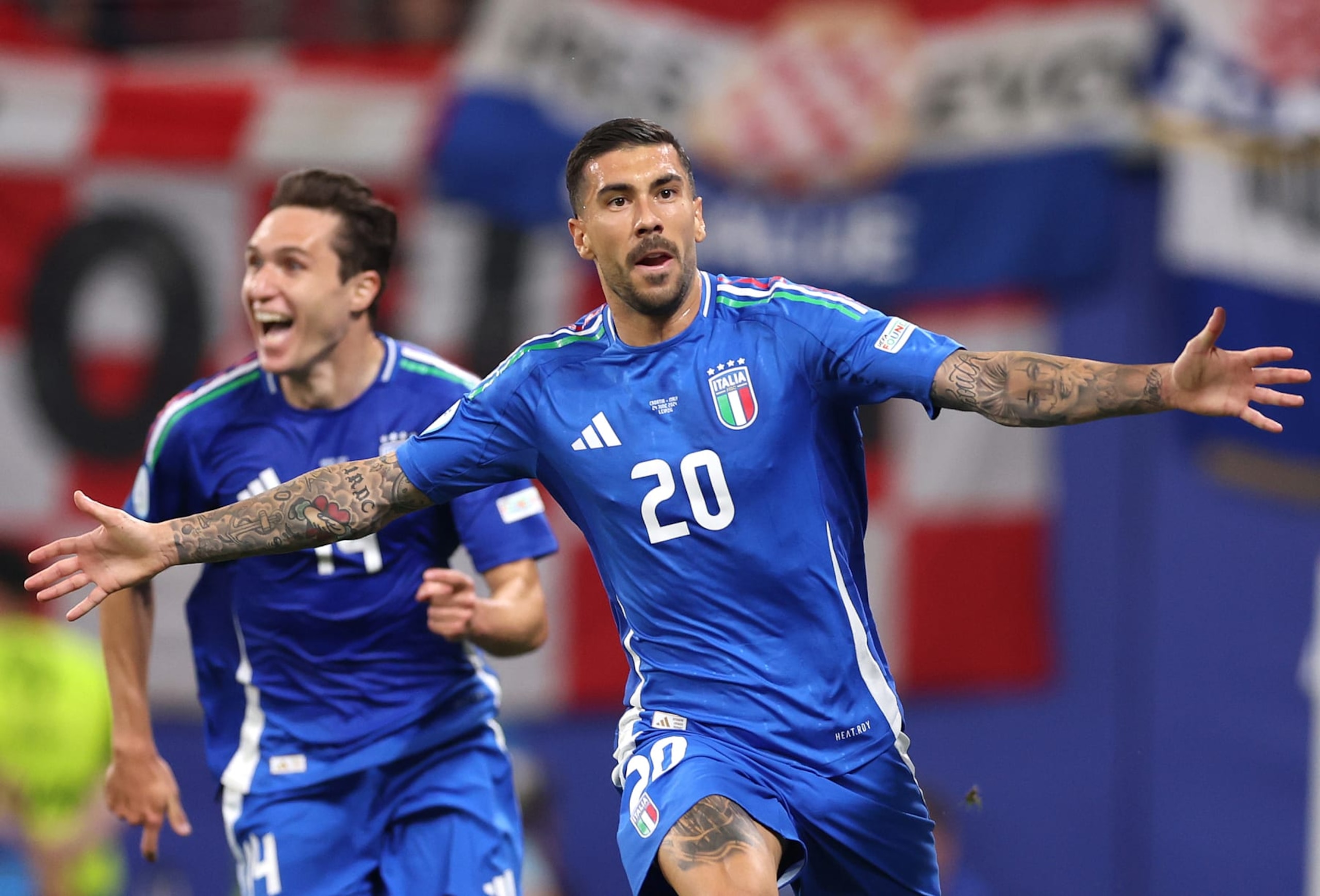 LEIPZIG, GERMANY - JUNE 24: Mattia Zaccagni of Italy celebrates scoring his team's first goal to equalise during the UEFA EURO 2024 group stage match between Croatia and Italy at Football Stadium Leipzig on June 24, 2024 in Leipzig, Germany. (Photo by Alex Pantling - UEFA/UEFA via Getty Images) LEIPZIG, GERMANY - JUNE 24: Mattia Zaccagni of Italy celebrates scoring his team's first goal to equalise during the UEFA EURO 2024 group stage match between Croatia and Italy at Football Stadium Leipzig on June 24, 2024 in Leipzig, Germany. (Photo by Alex Pantling - UEFA/UEFA via Getty Images)