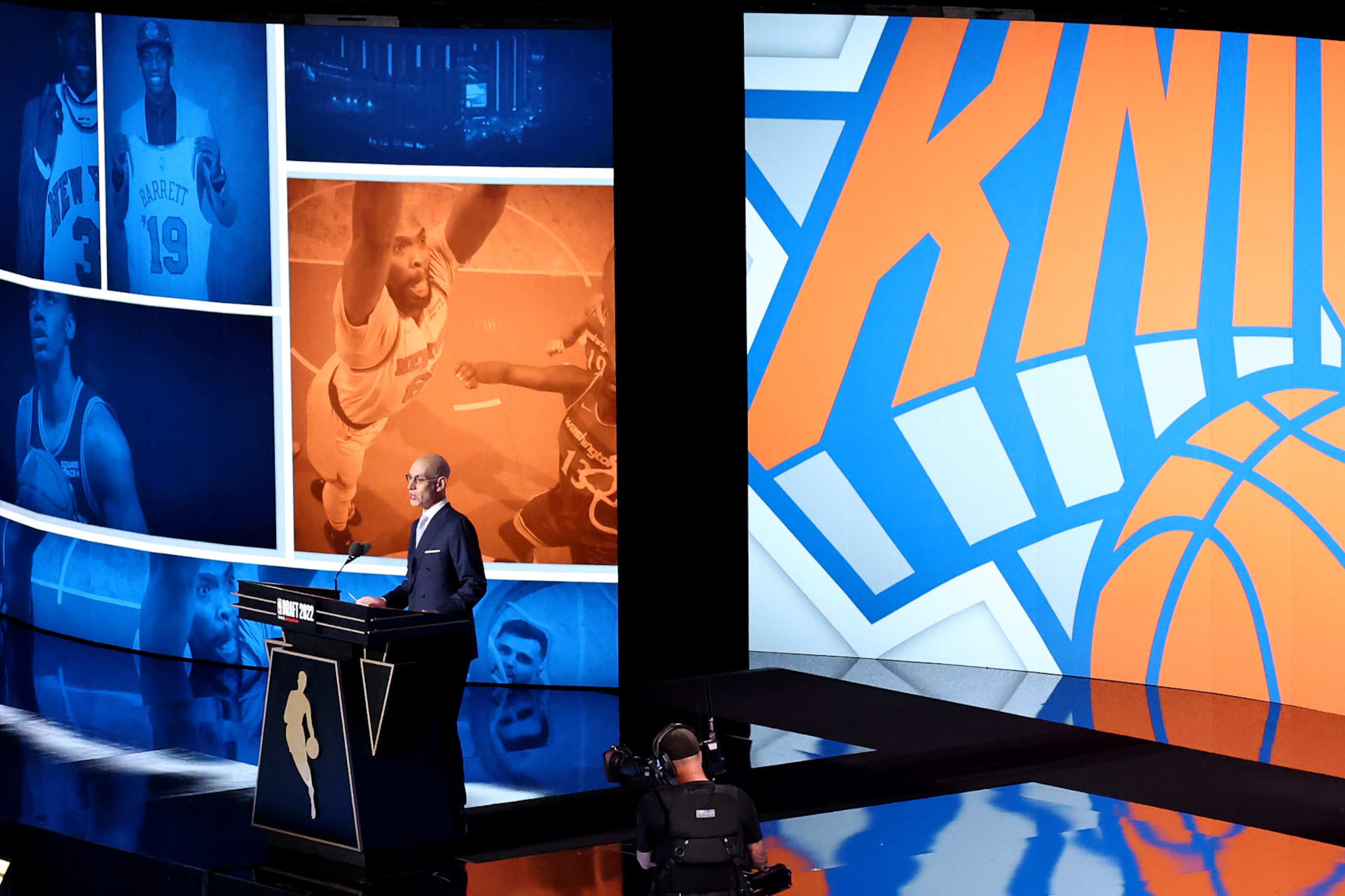 NEW YORK, NEW YORK - JUNE 23: NBA commissioner Adam Silver announces a pick by the New York Knicks during the 2022 NBA Draft at Barclays Center on June 23, 2022 in New York City. NOTE TO USER: User expressly acknowledges and agrees that, by downloading and or using this photograph, User is consenting to the terms and conditions of the Getty Images License Agreement. (Photo by Arturo Holmes/Getty Images)