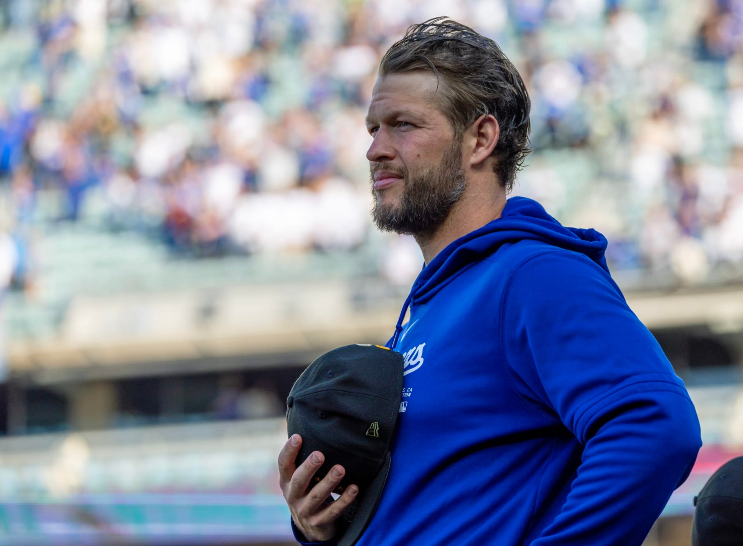 LOS ANGELES, CA - MAY18, 2024: Dodgers pitcher Clayton Kershaw holds his cap to this chest during the playing of the National Anthem before the game against the Cincinnati Reds at Dodger Stadium on May 18, 2024 in Los Angeles, California.(Gina Ferazzi / Los Angeles Times via Getty Images)