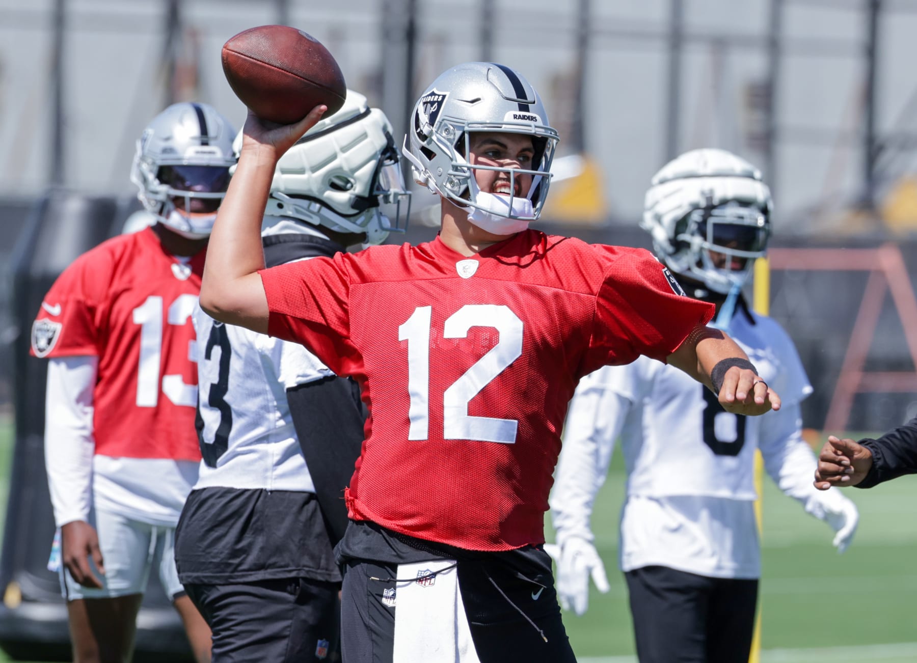 HENDERSON, NEVADA - MAY 29: Quarterback Aidan O'Connell #12 of the Las Vegas Raiders throws during an OTA offseason workout at the Las Vegas Raiders Headquarters/Intermountain Healthcare Performance Center on May 29, 2024 in Henderson, Nevada. (Photo by Ethan Miller/Getty Images)