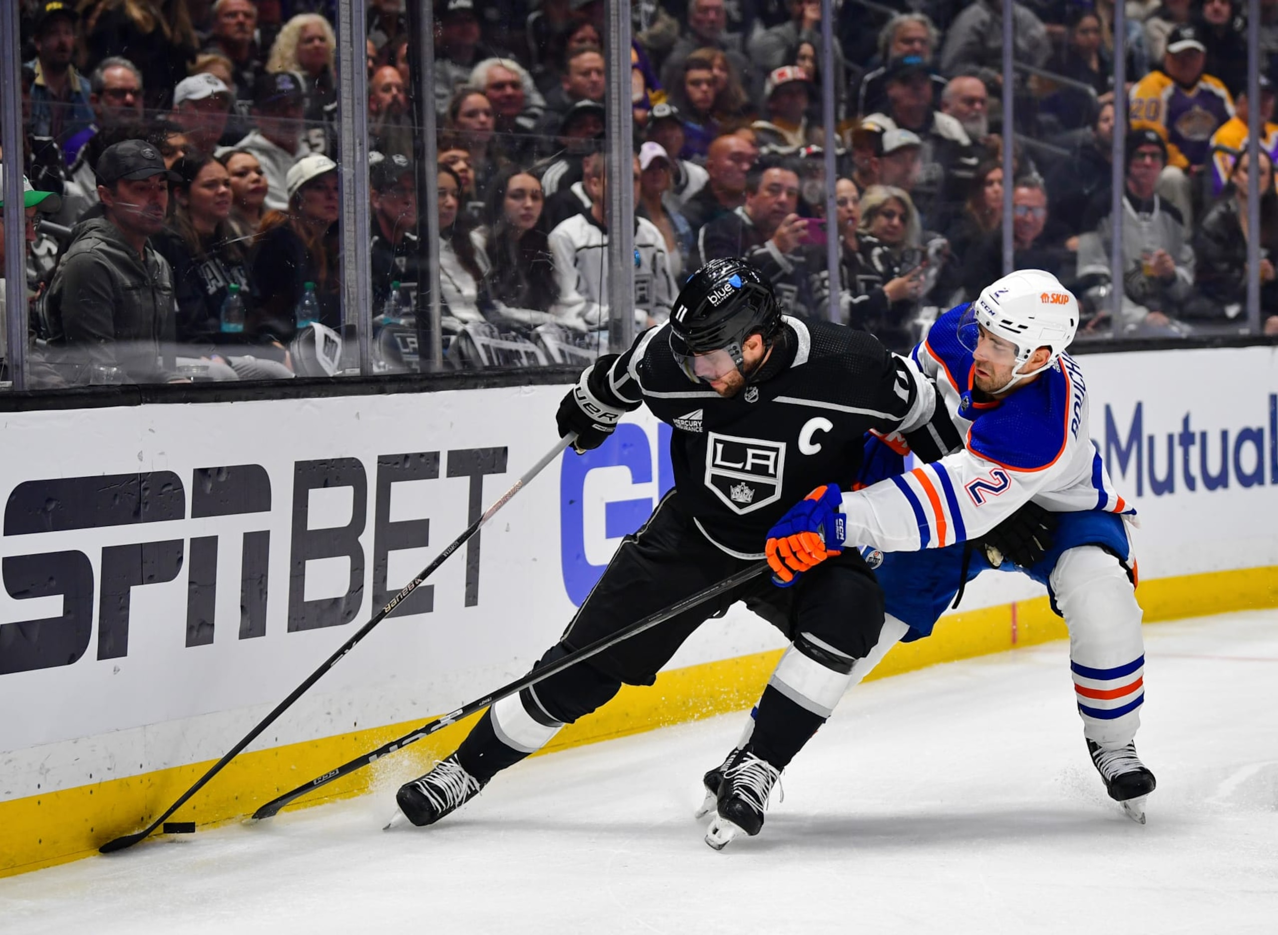 LOS ANGELES, CA - APRIL 28: Anze Kopitar #11 of the Los Angeles Kings and Evan Bouchard #2 of the Edmonton Oilers battles for position during the first period in Game Four of the First Round of the 2024 Stanley Cup Playoffs at Crypto.com Arena on April 28, 2024 in Los Angeles, California. (Photo by Gary A. Vasquez/NHLI via Getty Images)