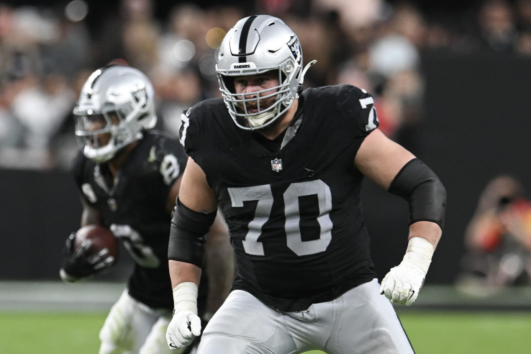 LAS VEGAS, NEVADA - NOVEMBER 26: Guard Greg Van Roten #70 of the Las Vegas Raiders looks down field during a play against the Kansas City Chiefs in the fourth quarter at Allegiant Stadium on November 26, 2023 in Las Vegas, Nevada. The Chiefs defeated the Raiders 31-17. (Photo by Candice Ward/Getty Images)