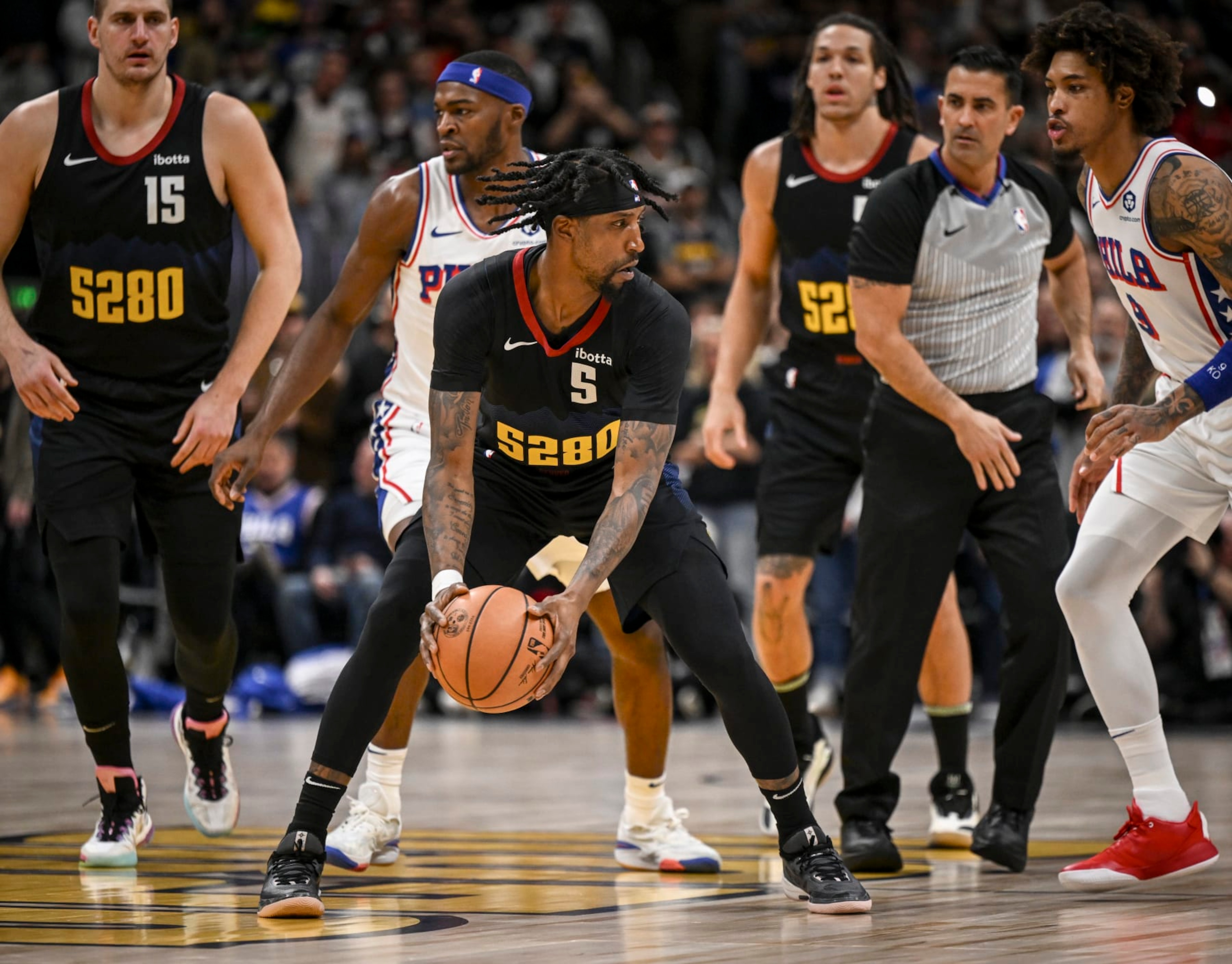 DENVER, CO - JANUARY 27: Kentavious Caldwell-Pope (5) of the Denver Nuggets grabs the tipoff against the Philadelphia 76ers during the first quarter at Ball Arena in Denver on Saturday, January 27, 2024. (Photo by AAron Ontiveroz/The Denver Post) DENVER, CO - JANUARY 27: Kentavious Caldwell-Pope (5) of the Denver Nuggets grabs the tipoff against the Philadelphia 76ers during the first quarter at Ball Arena in Denver on Saturday, January 27, 2024. (Photo by AAron Ontiveroz/The Denver Post)