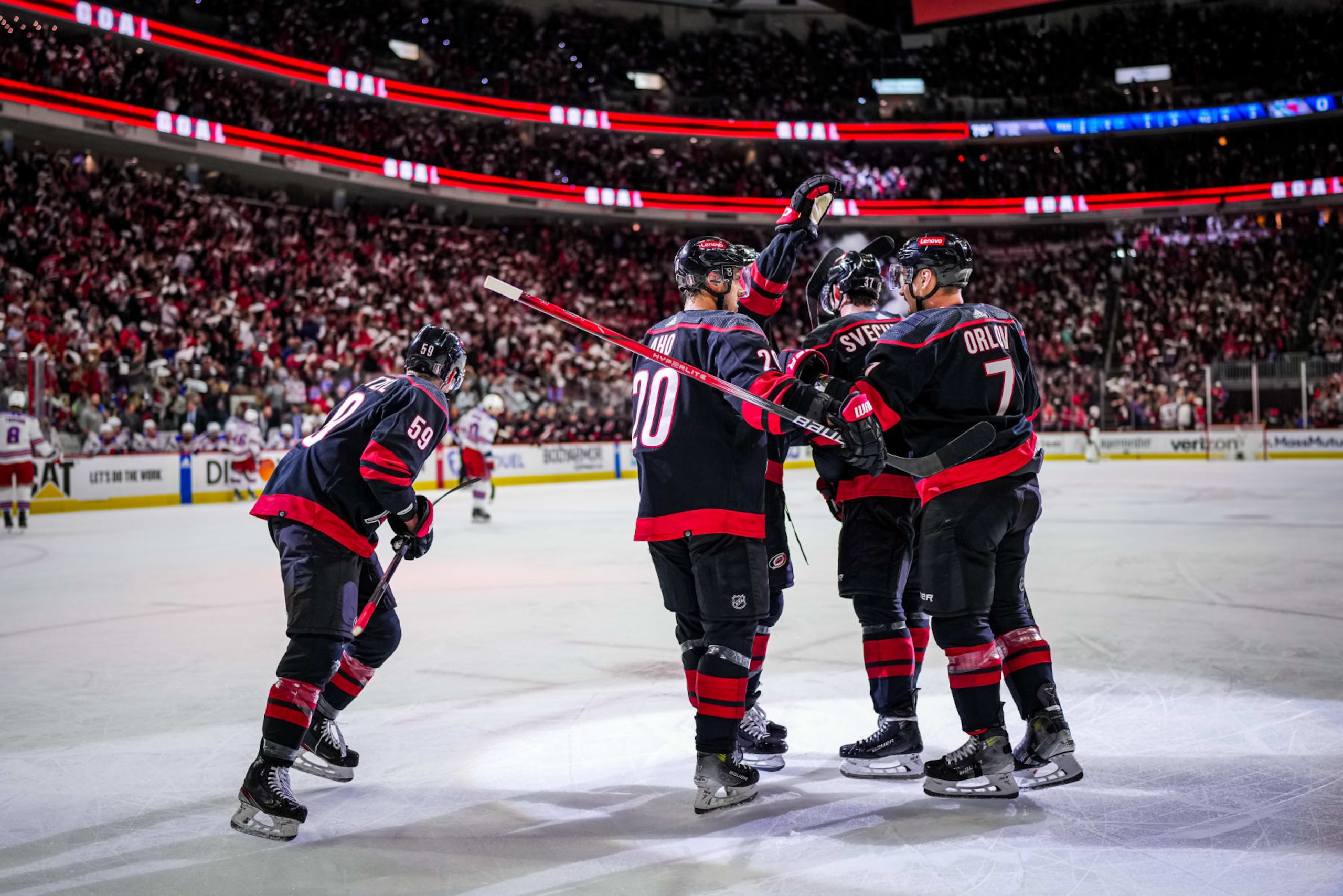 RALEIGH, NORTH CAROLINA - MAY 09: Jake Guentzel #59 of the Carolina Hurricanes celebrates his goal against the New York Rangers with teammates Dmitry Orlov #7, Sebastian Aho #20, Andrei Svechnikov #37 and Jalen Chatfield #5 during the first period in Game Three of the Second Round of the 2024 Stanley Cup Playoffs at PNC Arena on May 09, 2024 in Raleigh, North Carolina.  (Photo by Josh Lavallee/NHLI via Getty Images)