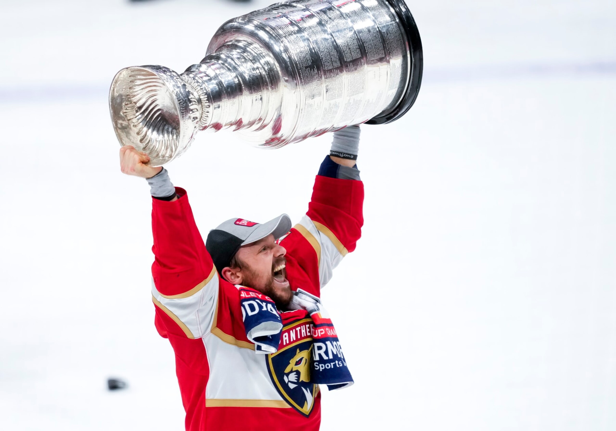 SUNRISE, FL - JUNE 24:  Florida Panthers center Sam Reinhart (13) raises the Stanley Cup  during the NHL Stanley Cup Finals, Game 7 between the Florida Panthers and Edmonton Oilers on June 24th, 2024 at Amerant Bank Arena in Sunrise, FL. (Photo by Andrew Bershaw/Icon Sportswire via Getty Images)