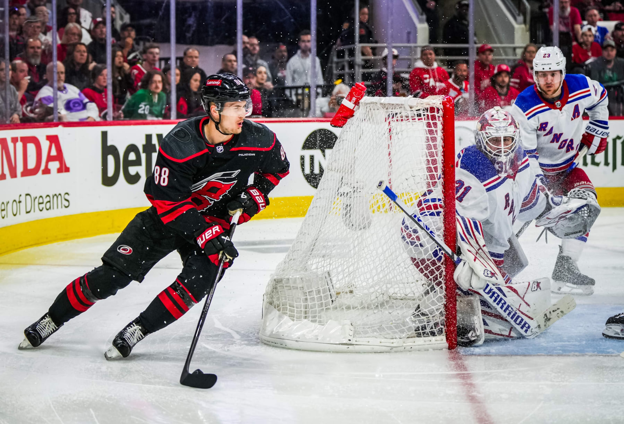 RALEIGH, NORTH CAROLINA - MAY 09: Martin Necas #88 of the Carolina Hurricanes plays the puck against the New York Rangers during the third period in Game Three of the Second Round of the 2024 Stanley Cup Playoffs at PNC Arena on May 09, 2024 in Raleigh, North Carolina.  (Photo by Josh Lavallee/NHLI via Getty Images)