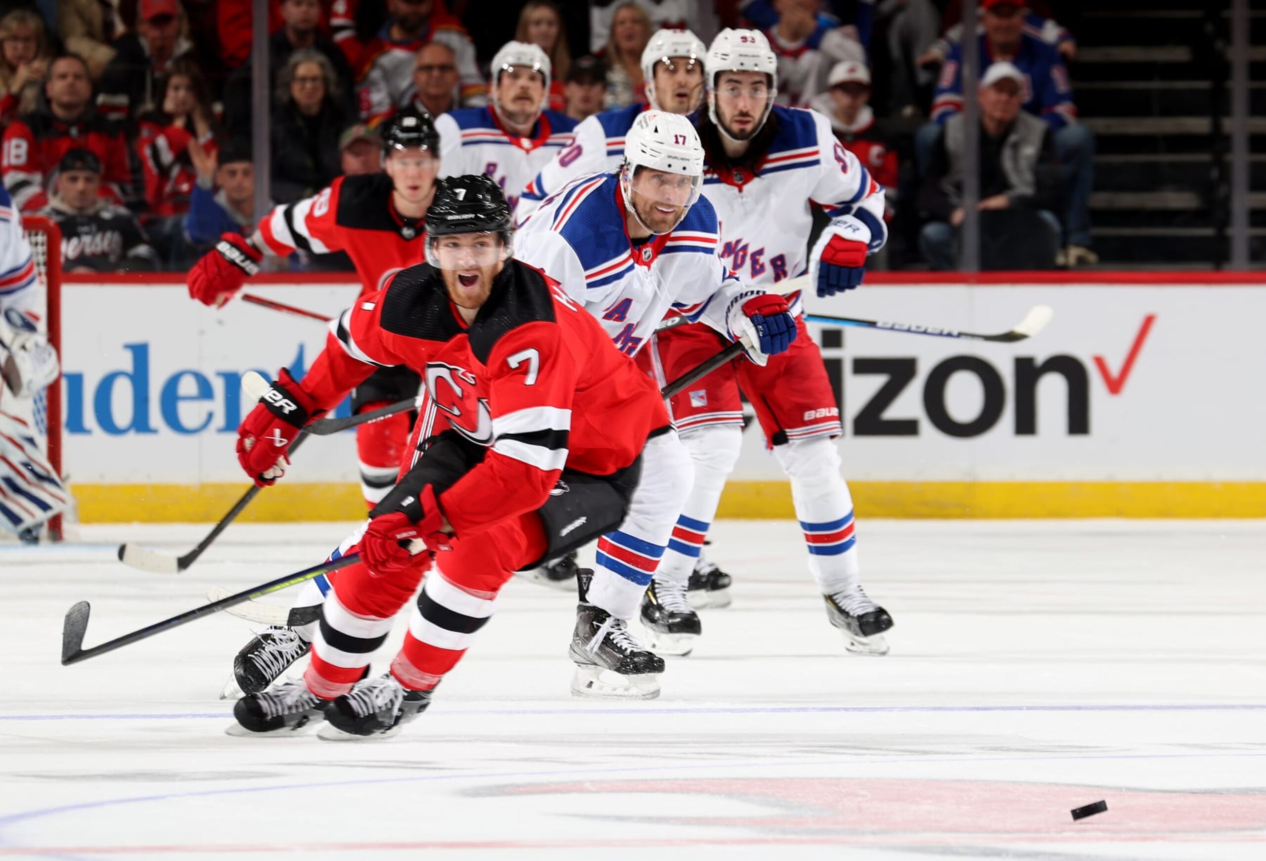 NEWARK, NEW JERSEY - NOVEMBER 18: Blake Wheeler #17 of the New York Rangers scores an empty net goal as Dougie Hamilton #7 of the New Jersey Devils reacts during the third period at Prudential Center on November 18, 2023 in Newark, New Jersey. The New York Rangers defeated the New Jersey Devils 5-3. (Photo by Elsa/Getty Images)