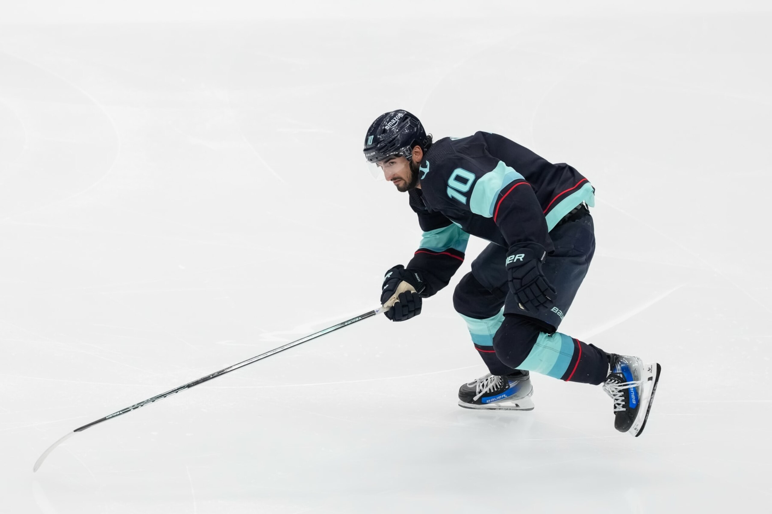 SEATTLE, WASHINGTON - APRIL 11: Matty Beniers #10 of the Seattle Kraken skates during the second period of a game against the San Jose Sharks at Climate Pledge Arena on April 11, 2024 in Seattle, Washington. (Photo by Christopher Mast/NHLI via Getty Images)