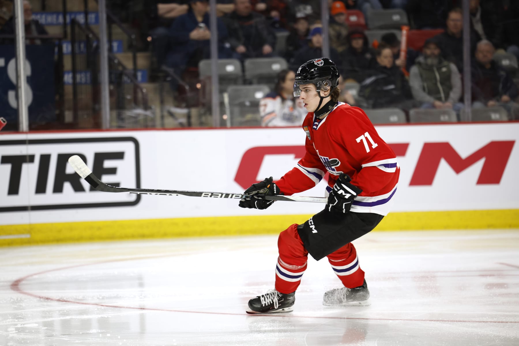 MONCTON, CANADA - JANUARY 24:Charlie Elick #71 of Team Red skates for the puck in the corner during the first period of the 2024 Kubota CHL Top Prospects Game at Avenir Centre on January 24, 2024 in Moncton, Canada. (Photo by Dale Preston/Getty Images)