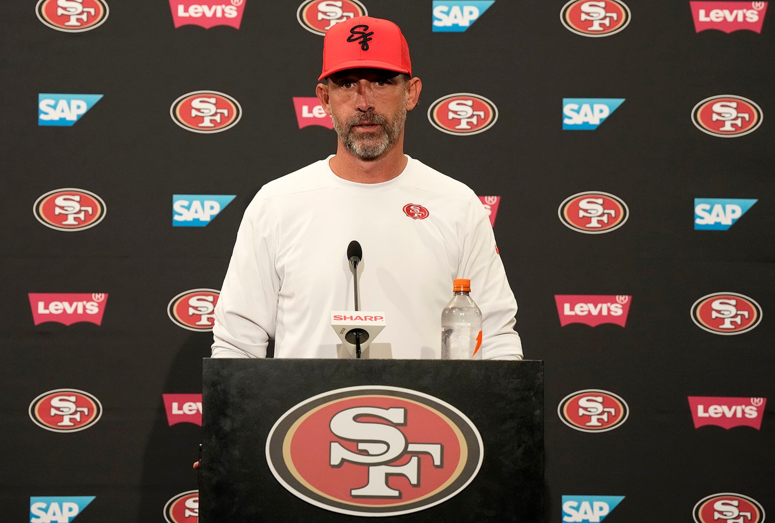 SANTA CLARA, CALIFORNIA - JUNE 04: Head coach Kyle Shanahan of the San Francisco 49ers speaks to the media during a press conference after a mini camp work out on June 04, 2024 in Santa Clara, California. (Photo by Thearon W. Henderson/Getty Images) SANTA CLARA, CALIFORNIA - JUNE 04: Head coach Kyle Shanahan of the San Francisco 49ers speaks to the media during a press conference after a mini camp work out on June 04, 2024 in Santa Clara, California. (Photo by Thearon W. Henderson/Getty Images)