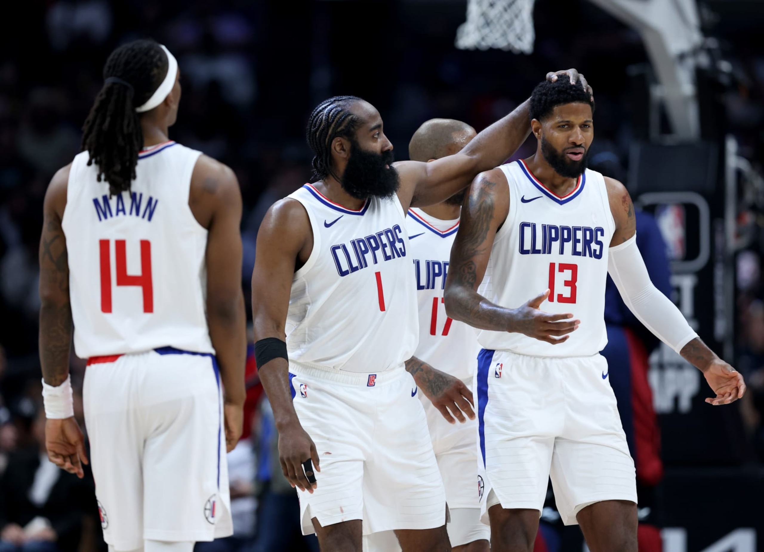 LOS ANGELES, CALIFORNIA - APRIL 04: Paul George #13 of the LA Clippers is restrained by James Harden #1 of the LA Clippers arguing for a foul during a 102-100 win over the Denver Nuggets at Crypto.com Arena on April 04, 2024 in Los Angeles, California. User is consenting to the terms and conditions of the Getty Images License Agreement. (Photo by Harry How/Getty Images)