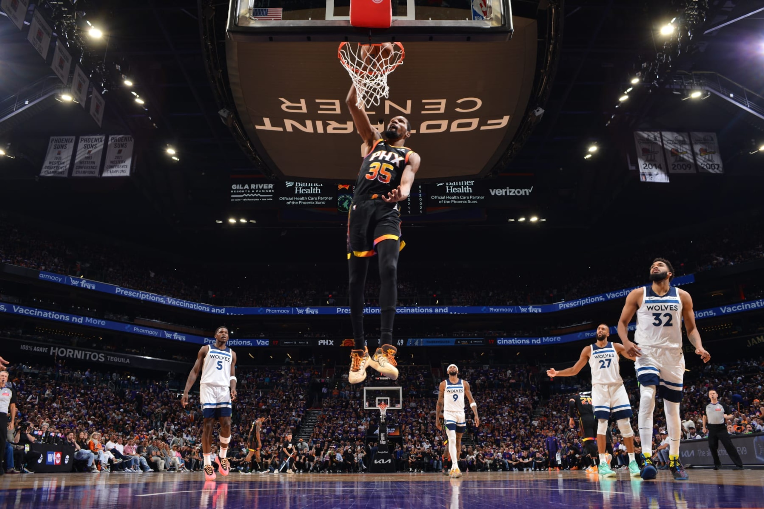 PHOENIX, AZ - APRIL 4: Kevin Durant #35 of the Phoenix Suns dunks the ball during the game against the Minnesota Timberwolves during Round 1 Game 4 of the 2024 NBA Playoffs on April 4, 2023 at Footprint Center in Phoenix, Arizona. NOTE TO USER: User expressly acknowledges and agrees that, by downloading and or using this photograph, user is consenting to the terms and conditions of the Getty Images License Agreement. Mandatory Copyright Notice: Copyright 2024 NBAE (Photo by Barry Gossage/NBAE via Getty Images)