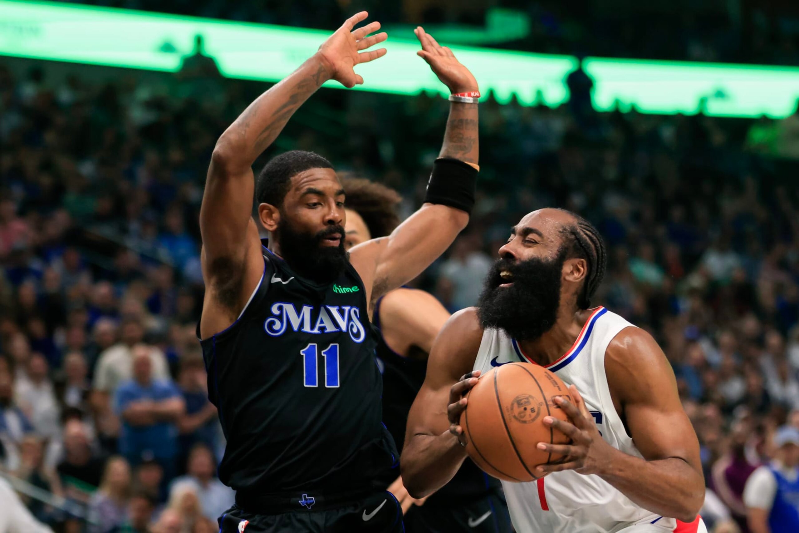 DALLAS, TEXAS - MAY 03: James Harden #1 of the LA Clippers drives to the basket against Kyrie Irving #11 of the Dallas Mavericks during the first quarter in Game Six of the Western Conference First Round Playoffs at American Airlines Center on May 03, 2024 in Dallas, Texas.  (Photo by Ron Jenkins/Getty Images)