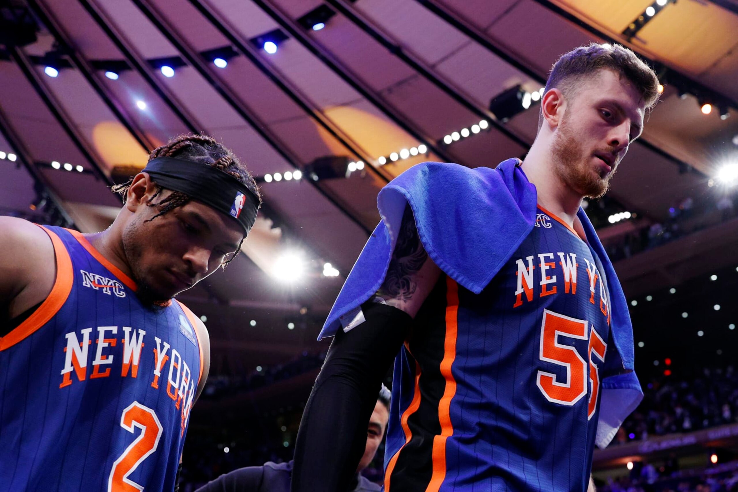 NEW YORK, NEW YORK - MAY 14: Isaiah Hartenstein #55 and Miles McBride #2 of the New York Knicks leave the court after Game Five of the Eastern Conference Second Round Playoffs against the Indiana Pacers at Madison Square Garden on May 14, 2024 in New York City. The Knicks won 121-91. NOTE TO USER: User expressly acknowledges and agrees that, by downloading and or using this photograph, User is consenting to the terms and conditions of the Getty Images License Agreement. (Photo by Sarah Stier/Getty Images)