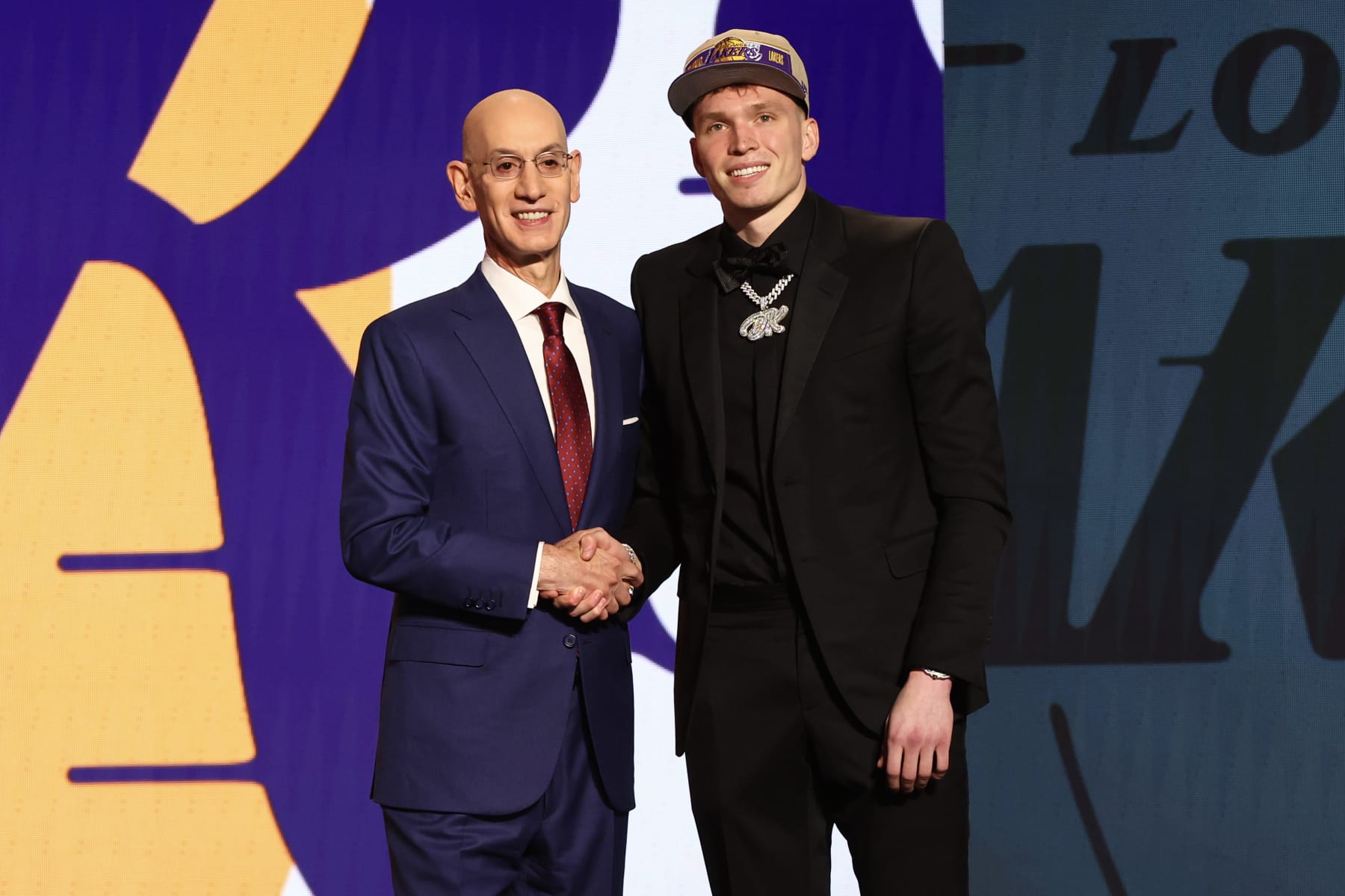 NEW YORK, NEW YORK - JUNE 26: Dalton Knecht (R) shakes hands with NBA commissioner Adam Silver (L) after being drafted 17th overall by the Los Angeles Lakers during the first round of the 2024 NBA Draft at Barclays Center on June 26, 2024 in the Brooklyn borough of New York City. NOTE TO USER: User expressly acknowledges and agrees that, by downloading and or using this photograph, User is consenting to the terms and conditions of the Getty Images License Agreement. (Photo by Sarah Stier/Getty Images)