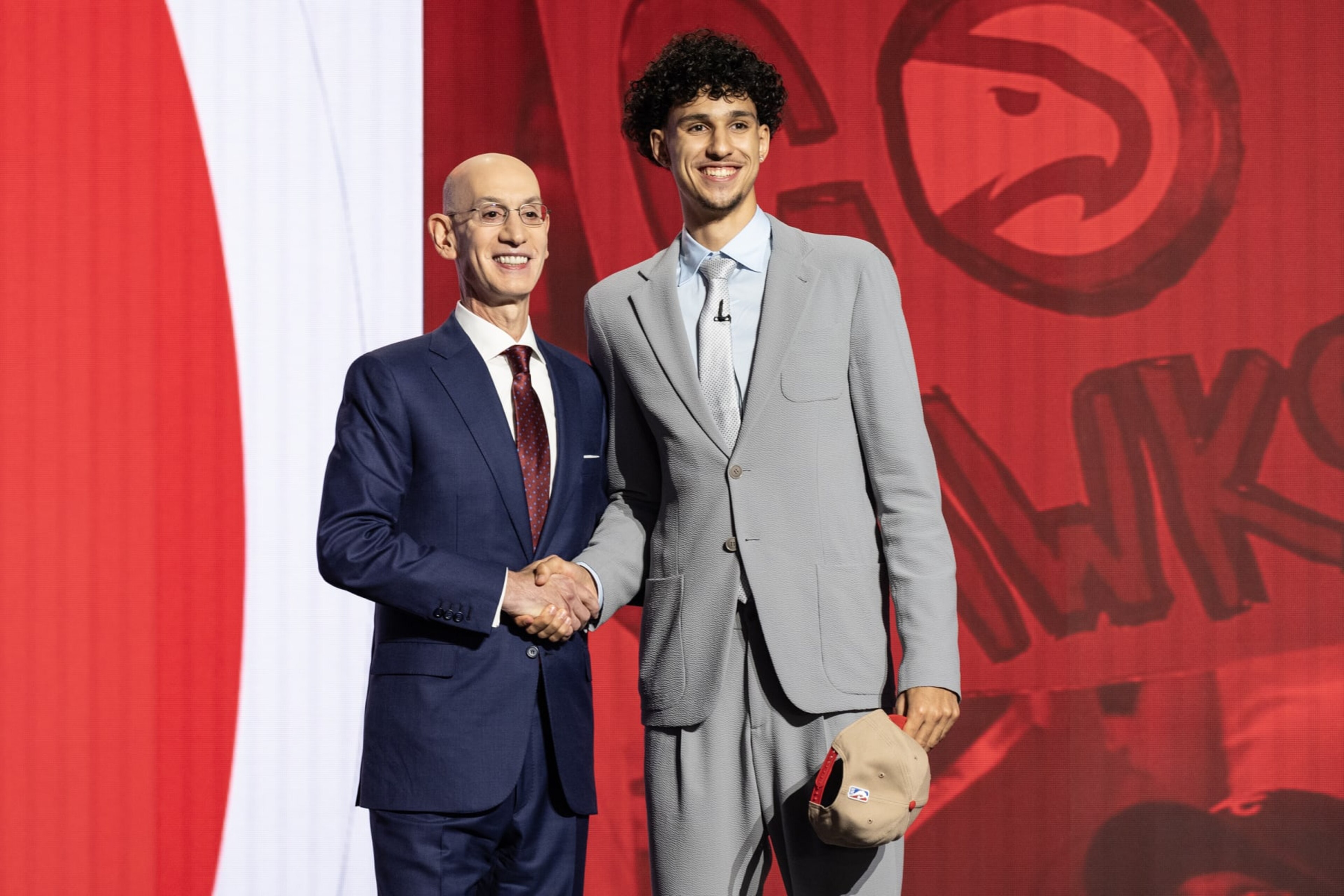 NEW YORK, UNITED STATES - JUNE 26: Commissioner Adam Silver shakes hands with Zaccharie Risacher, selected as number one by the Atlanta Hawks, in the first round of the 2024 NBA Draft at the Barclays Center in Brooklyn, New York on June 26, 2024 (Photo by Lev Radin/Anadolu via Getty Images) NEW YORK, UNITED STATES - JUNE 26: Commissioner Adam Silver shakes hands with Zaccharie Risacher, selected as number one by the Atlanta Hawks, in the first round of the 2024 NBA Draft at the Barclays Center in Brooklyn, New York on June 26, 2024 (Photo by Lev Radin/Anadolu via Getty Images)