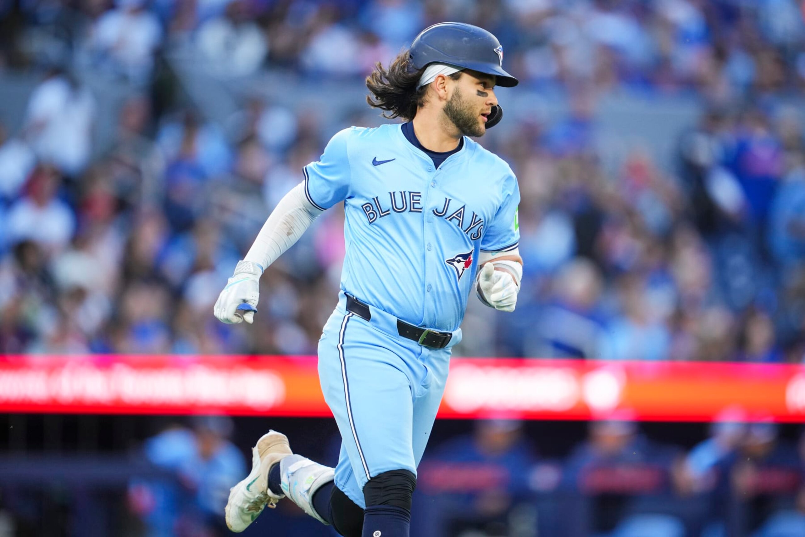 TORONTO, ON - JUNE 14: Bo Bichette #11 of Toronto Blue Jays runs to first base against the Cleveland Guardians during the fourth inning in their MLB game at the Rogers Centre on June 14, 2024 in Toronto, Ontario, Canada. (Photo by Mark Blinch/Getty Images) TORONTO, ON - JUNE 14: Bo Bichette #11 of Toronto Blue Jays runs to first base against the Cleveland Guardians during the fourth inning in their MLB game at the Rogers Centre on June 14, 2024 in Toronto, Ontario, Canada. (Photo by Mark Blinch/Getty Images)