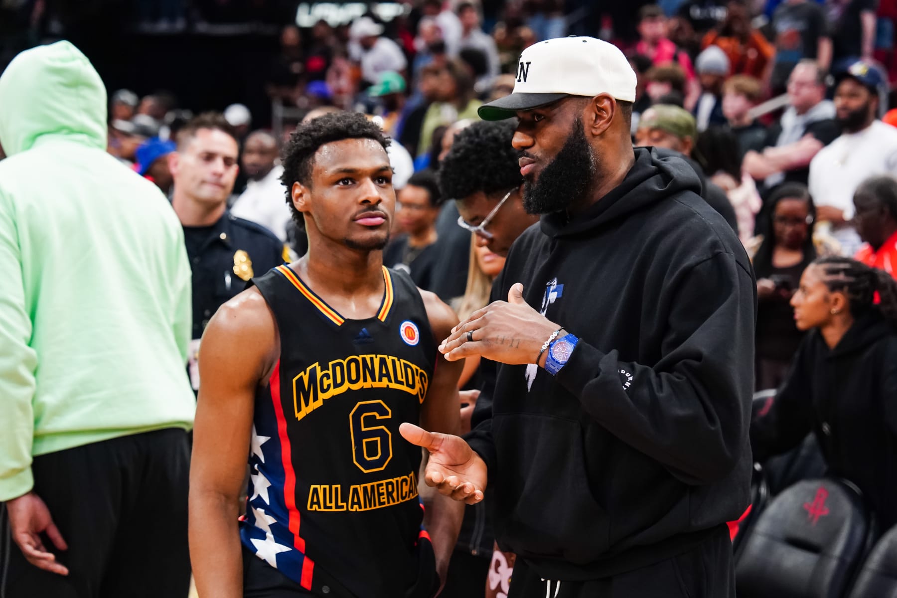 HOUSTON, TEXAS - MARCH 28: Bronny James #6 of the West team talks to Lebron James of the Los Angeles Lakers after the 2023 McDonald's High School Boys All-American Game at Toyota Center on March 28, 2023 in Houston, Texas. (Photo by Alex Bierens de Haan/Getty Images)