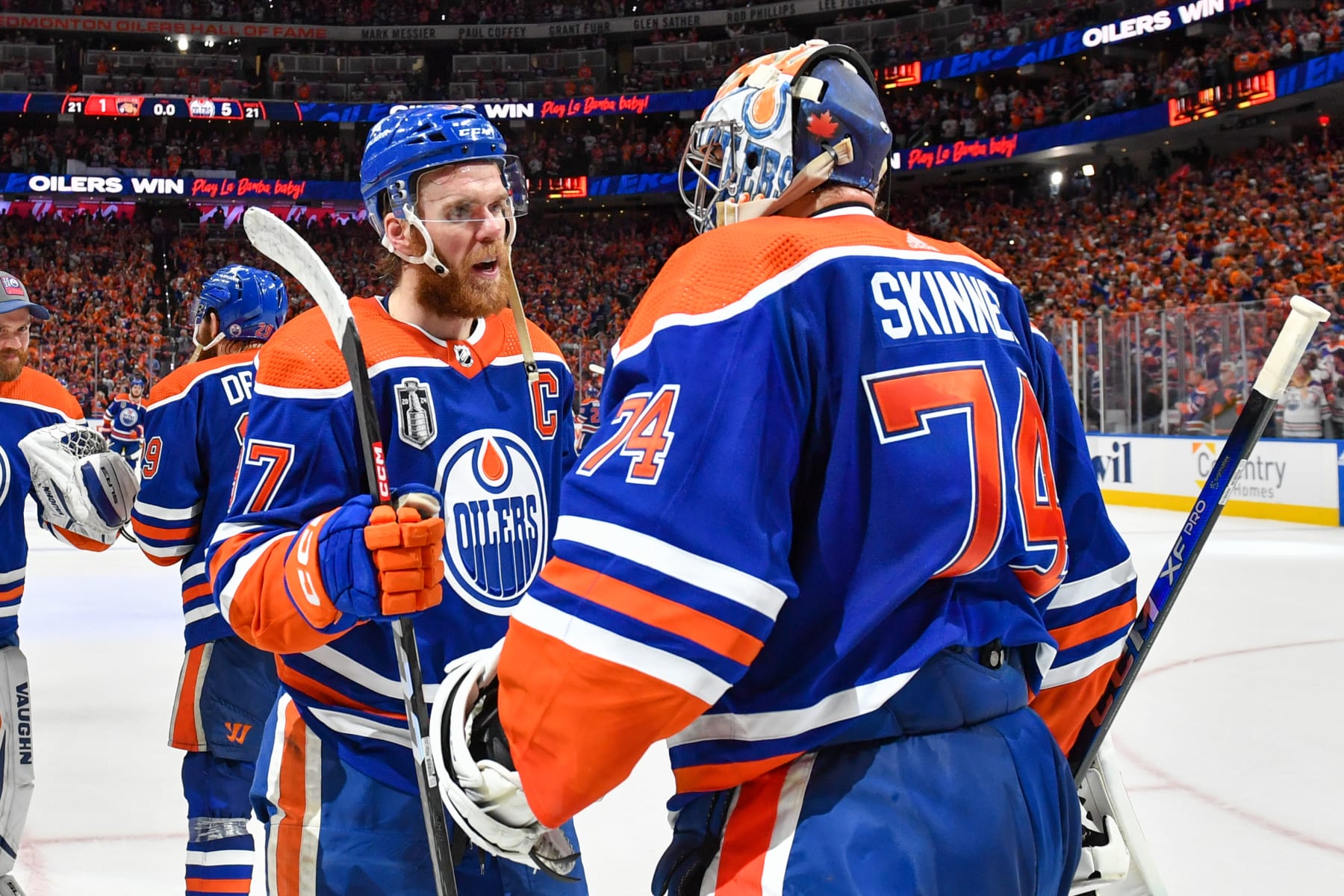 EDMONTON, CANADA - JUNE 21: Goaltender Stuart Skinner #74 and Connor McDavid #97 of the Edmonton Oilers celebrate their win against the Florida Panthers in Game Six of the 2024 Stanley Cup Final at Rogers Place on June 21, 2024, in Edmonton, Alberta, Canada. (Photo by Andy Devlin/NHLI via Getty Images)