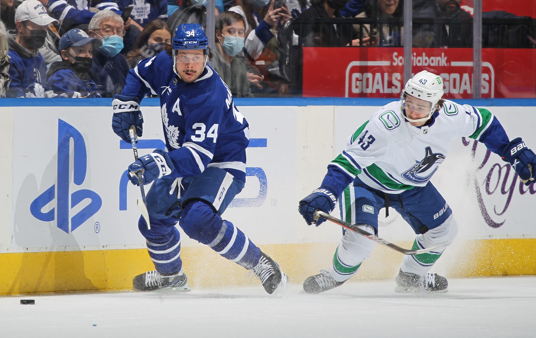 TORONTO, ON - MARCH 5:  Quinn Hughes #43 of the Vancouver Canucks tries to contain Auston Matthews #34 of the Toronto Maple Leafs during an NHL game at Scotiabank Arena on March 5, 2022 in Toronto, Ontario, Canada. The Canucks defeated the Maple Leafs 6-4. (Photo by Claus Andersen/Getty Images)