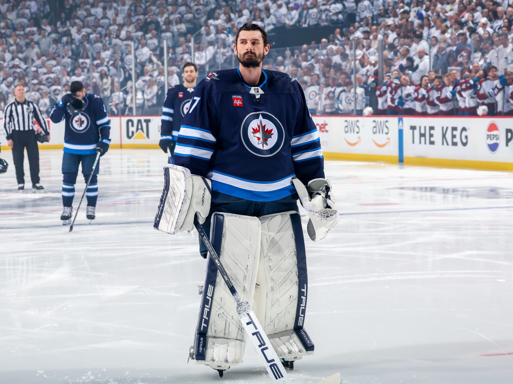 WINNIPEG, CANADA - APRIL 30: Goaltender Connor Hellebuyck #37 of the Winnipeg Jets looks on prior to NHL action against the Colorado Avalanche in Game Five of the First Round of the 2024 Stanley Cup Playoffs at Canada Life Centre on April 30, 2024 in Winnipeg, Manitoba, Canada. (Photo by Jonathan Kozub/NHLI via Getty Images)