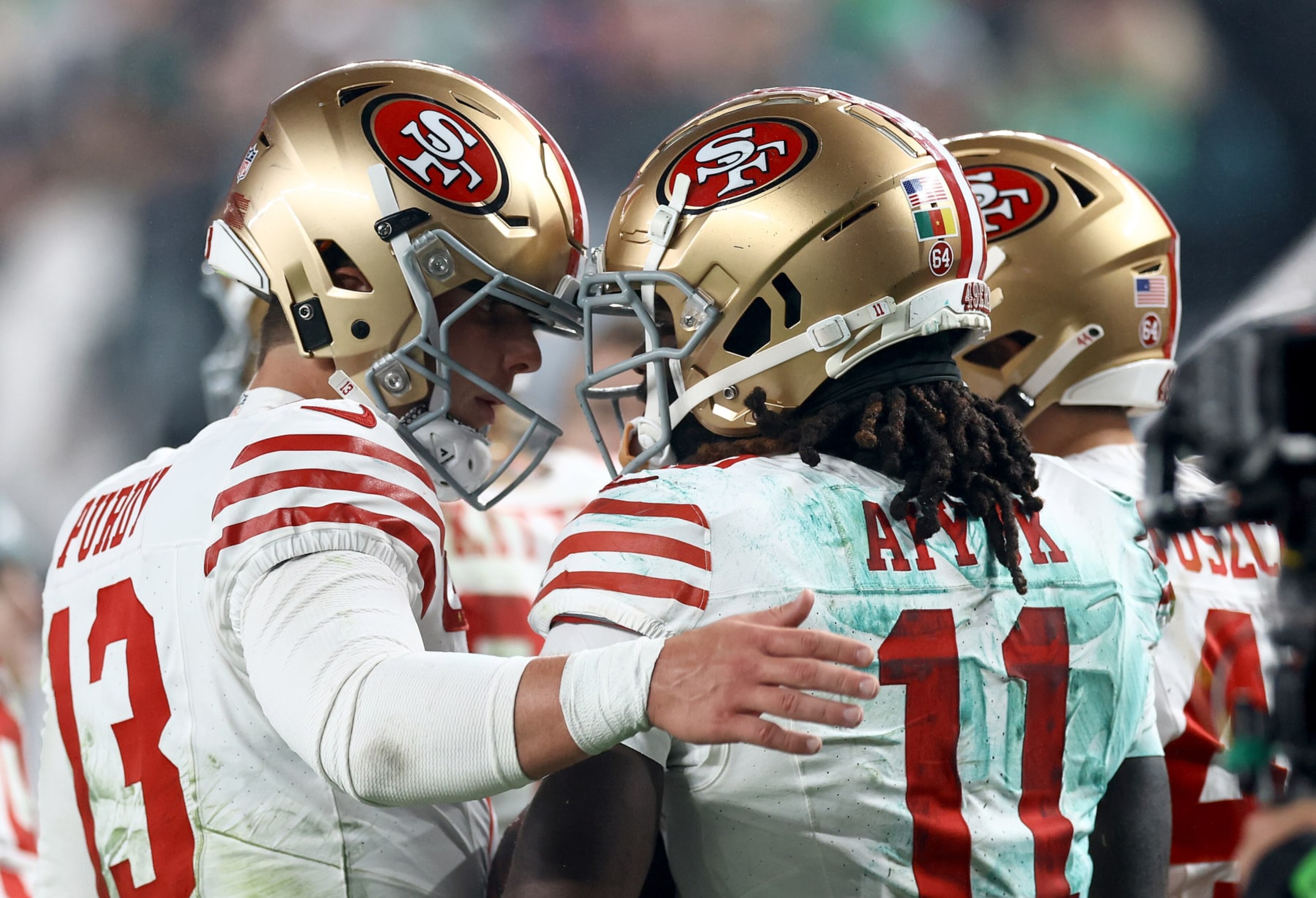 PHILADELPHIA, PENNSYLVANIA - DECEMBER 03: Brock Purdy #13 and Brandon Aiyuk #11 of the San Francisco 49ers celebrates after a touchdown during the second quarter in the game against the Philadelphia Eagles at Lincoln Financial Field on December 03, 2023 in Philadelphia, Pennsylvania. (Photo by Tim Nwachukwu/Getty Images)