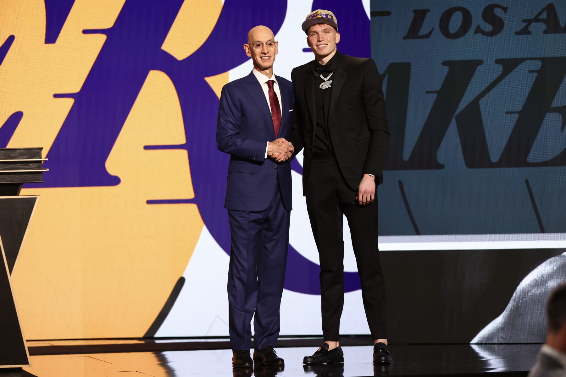 NEW YORK, NEW YORK - JUNE 26: Dalton Knecht (R) shakes hands with NBA commissioner Adam Silver (L) after being drafted 17th overall by the Los Angeles Lakers during the first round of the 2024 NBA Draft at Barclays Center on June 26, 2024 in the Brooklyn borough of New York City. NOTE TO USER: User expressly acknowledges and agrees that, by downloading and or using this photograph, User is consenting to the terms and conditions of the Getty Images License Agreement. (Photo by Sarah Stier/Getty Images)