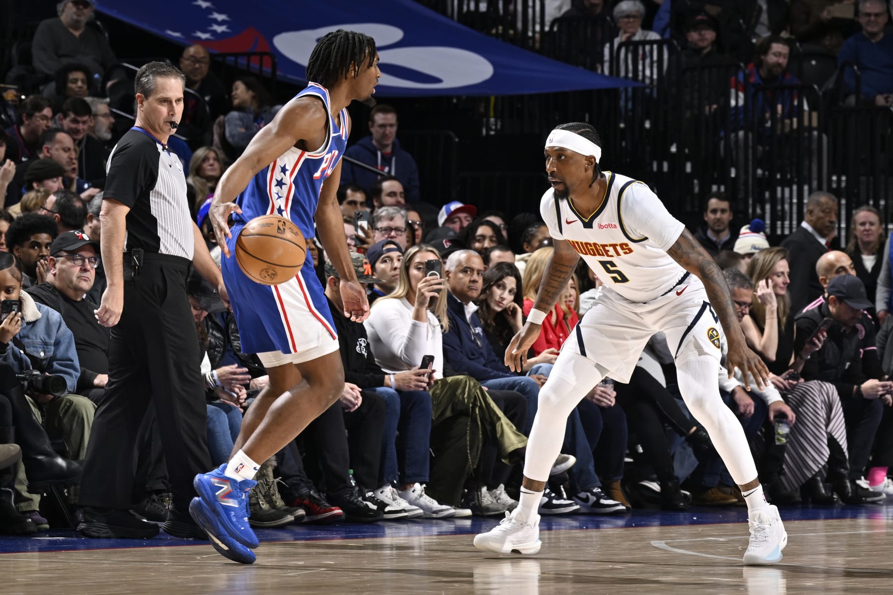 PHILADELPHIA, PA - JANUARY 16: Kentavious Caldwell-Pope #5 of the Denver Nuggets plays defense against Tyrese Maxey #0 of the Philadelphia 76ers on January 16, 2024 at the Wells Fargo Center in Philadelphia, Pennsylvania NOTE TO USER: User expressly acknowledges and agrees that, by downloading and/or using this Photograph, user is consenting to the terms and conditions of the Getty Images License Agreement. Mandatory Copyright Notice: Copyright 2024 NBAE (Photo by David Dow/NBAE via Getty Images)