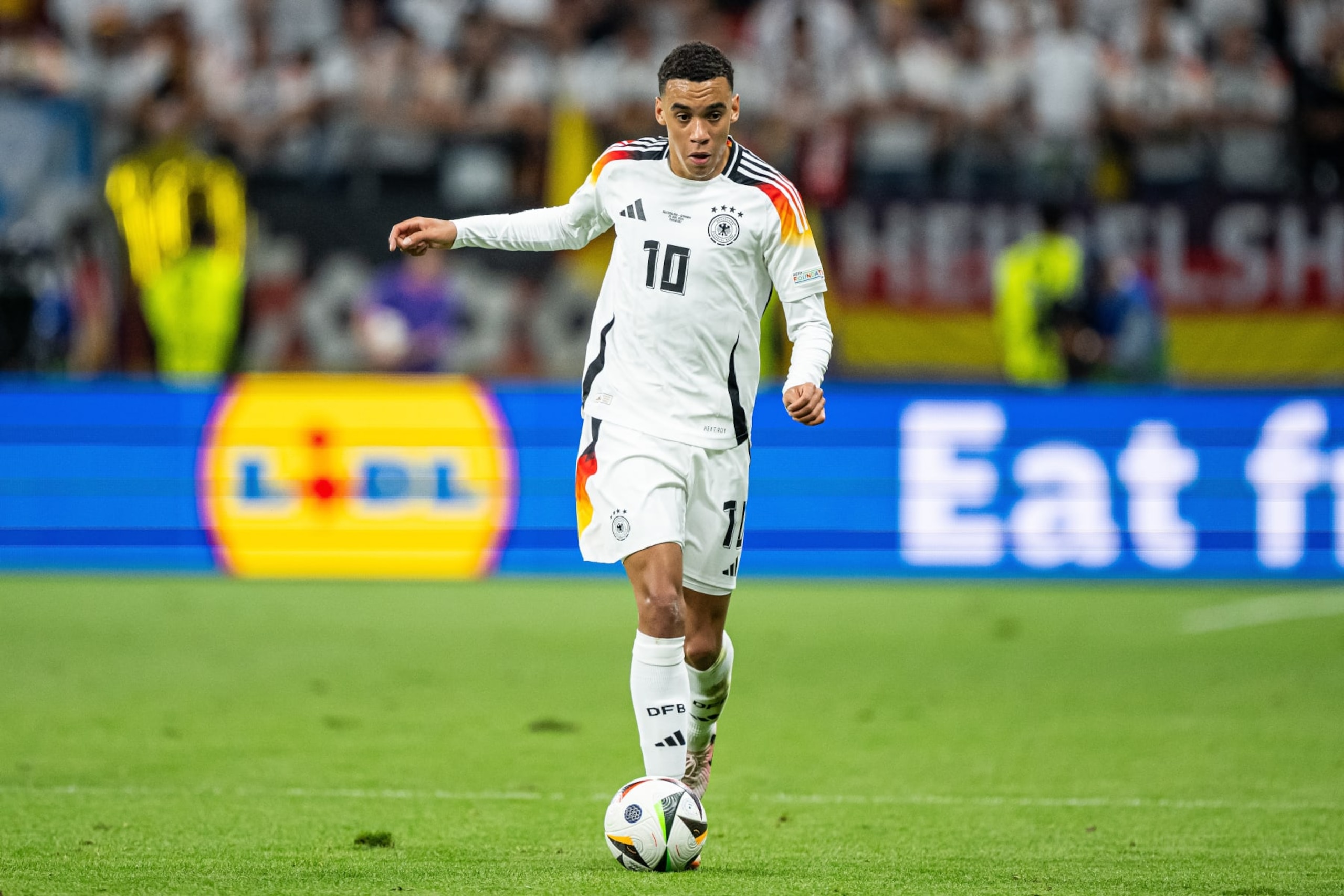 FRANKFURT AM MAIN, GERMANY - JUNE 23: Jamal Musiala  of Germany controls the ball  during the UEFA EURO 2024 group stage match between Switzerland and Germany at Frankfurt Arena on June 23, 2024 in Frankfurt am Main, Germany. (Photo by Marvin Ibo Guengoer - GES Sportfoto/Getty Images)