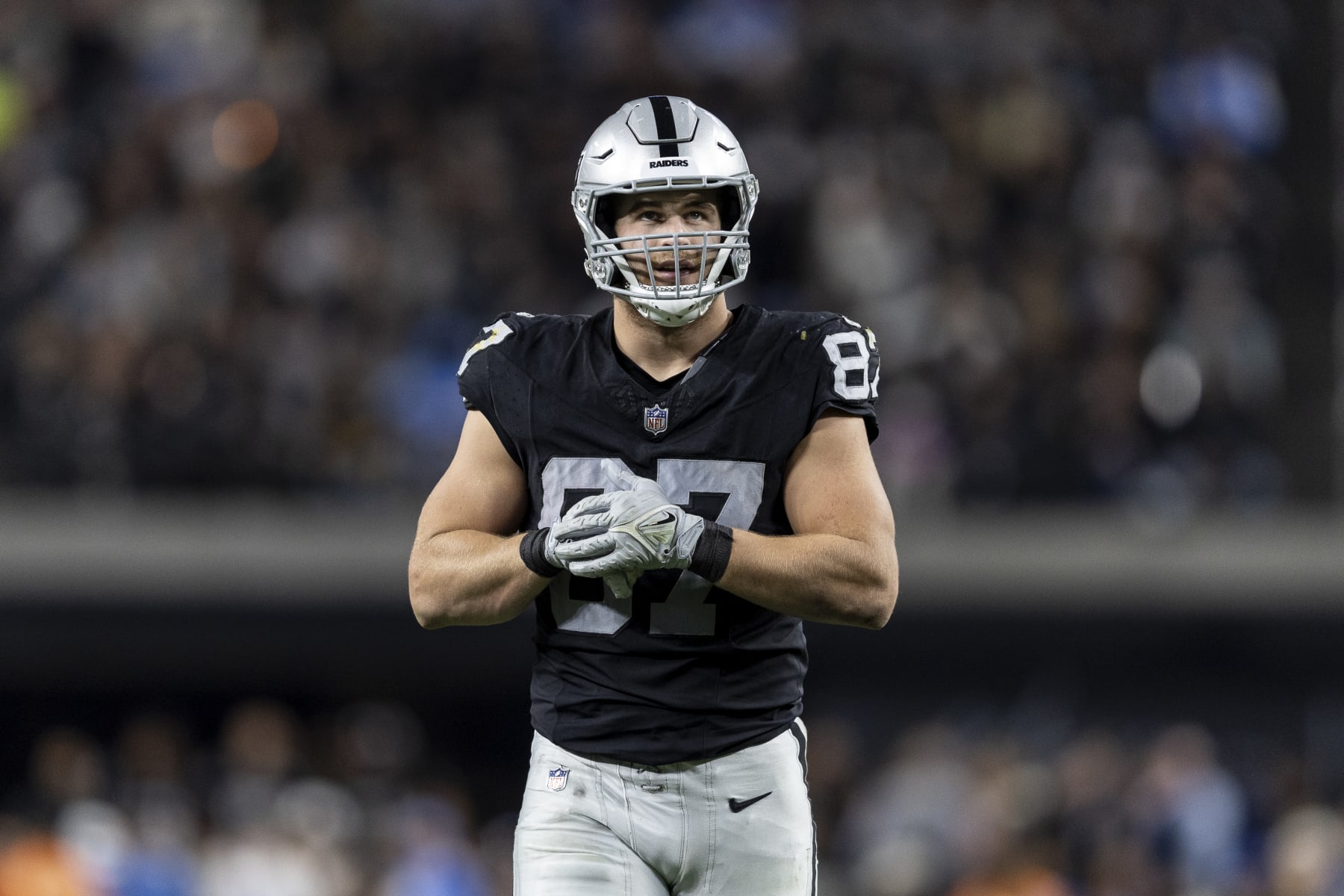 LAS VEGAS, NEVADA - DECEMBER 14: Michael Mayer #87 of the Las Vegas Raiders adjusts his gloves during an NFL football game between the Las Vegas Raiders and the Los Angeles Chargers at Allegiant Stadium on December 14, 2023 in Las Vegas, Nevada. (Photo by Michael Owens/Getty Images)