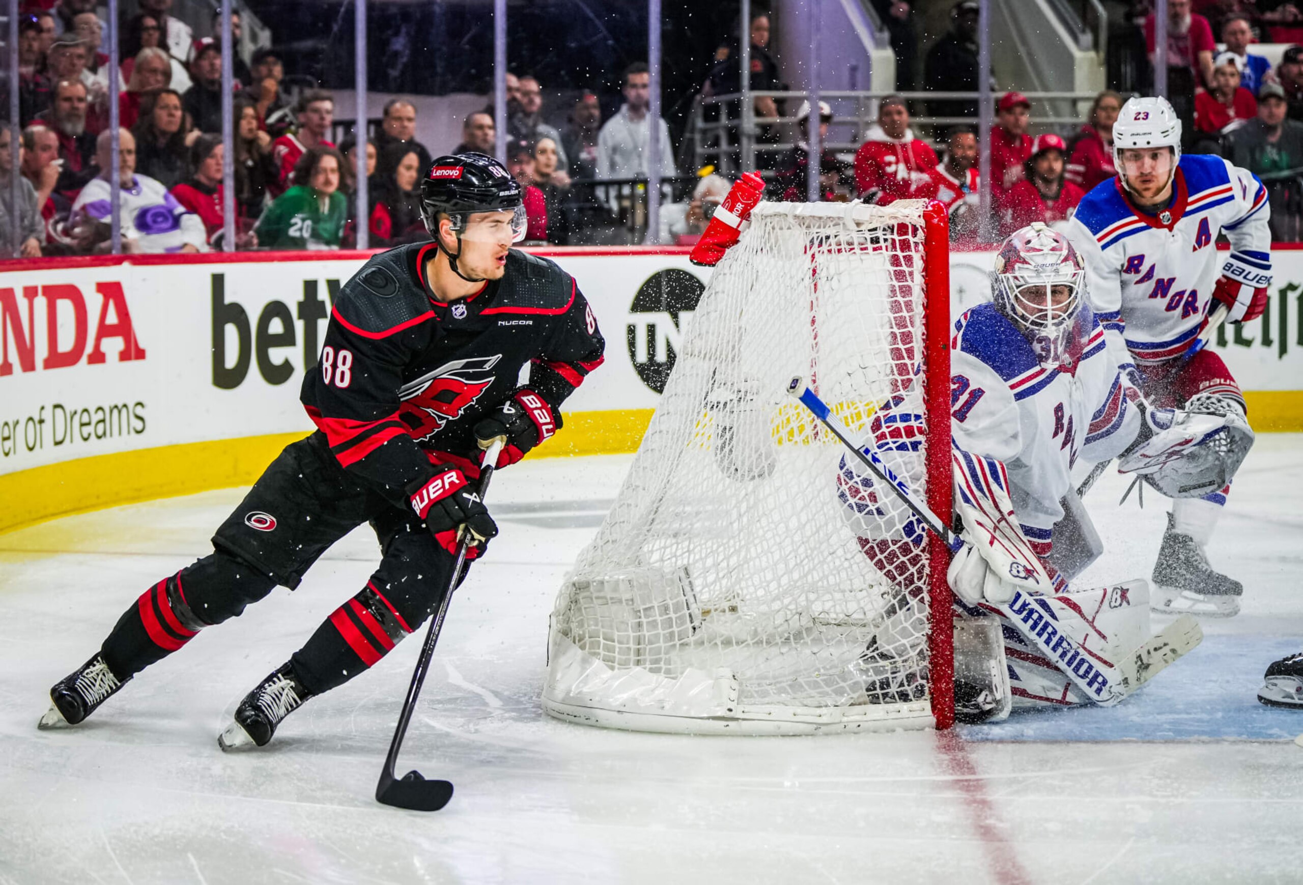 RALEIGH, NORTH CAROLINA - MAY 09: Martin Necas #88 of the Carolina Hurricanes plays the puck against the New York Rangers during the third period in Game Three of the Second Round of the 2024 Stanley Cup Playoffs at PNC Arena on May 09, 2024 in Raleigh, North Carolina. (Photo by Josh Lavallee/NHLI via Getty Images) RALEIGH, NORTH CAROLINA - MAY 09: Martin Necas #88 of the Carolina Hurricanes plays the puck against the New York Rangers during the third period in Game Three of the Second Round of the 2024 Stanley Cup Playoffs at PNC Arena on May 09, 2024 in Raleigh, North Carolina. (Photo by Josh Lavallee/NHLI via Getty Images)