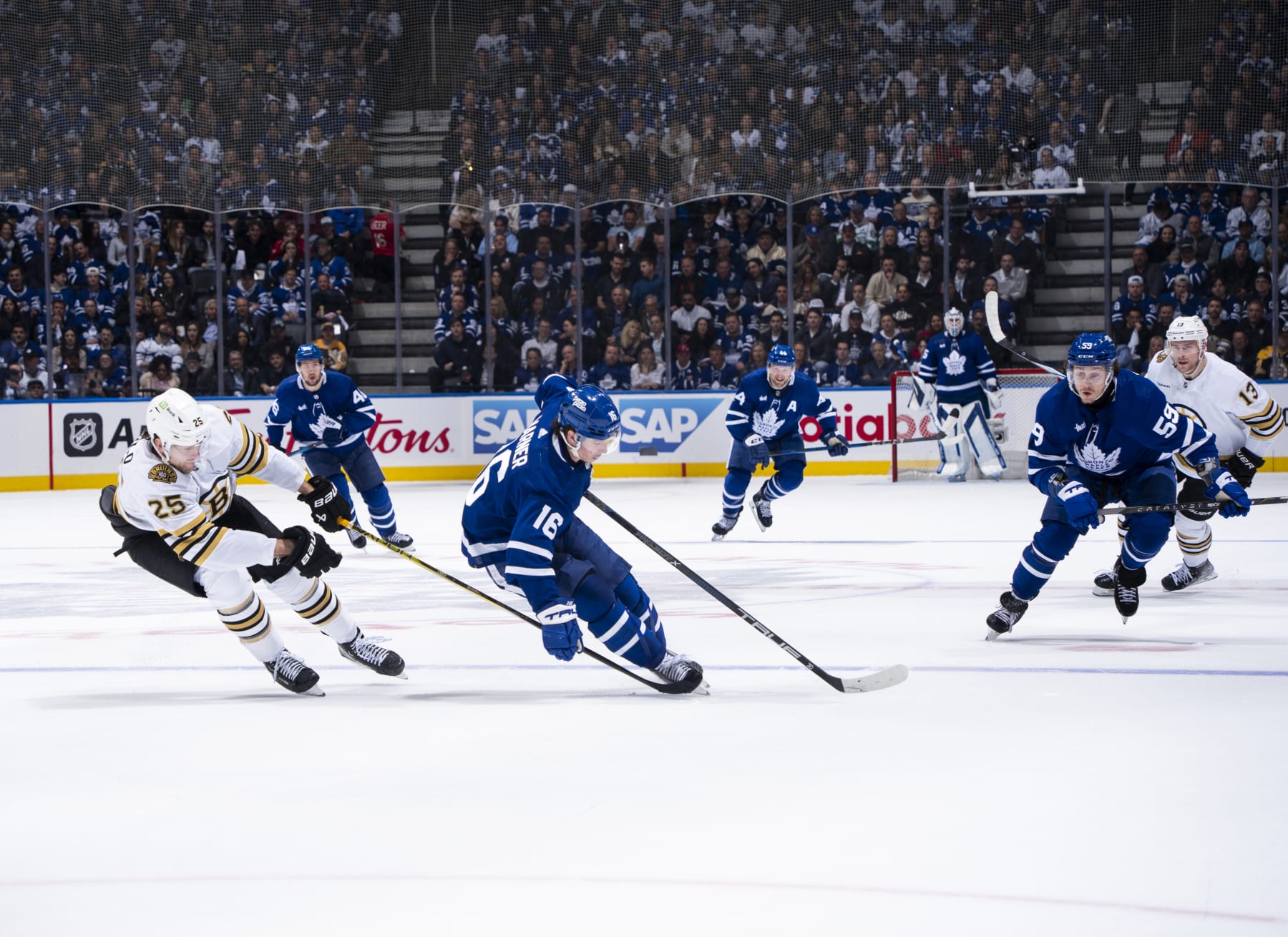 TORONTO, ON - APRIL 27: Mitchell Marner #16 of the Toronto Maple Leafs skates against Brandon Carlo #25 of the Boston Bruins during the first period in Game Four of the First Round of the 2024 Stanley Cup Playoffs at Scotiabank Arena on April 27, 2024 in Toronto, Ontario, Canada. (Photo by Mark Blinch/NHLI via Getty Images)