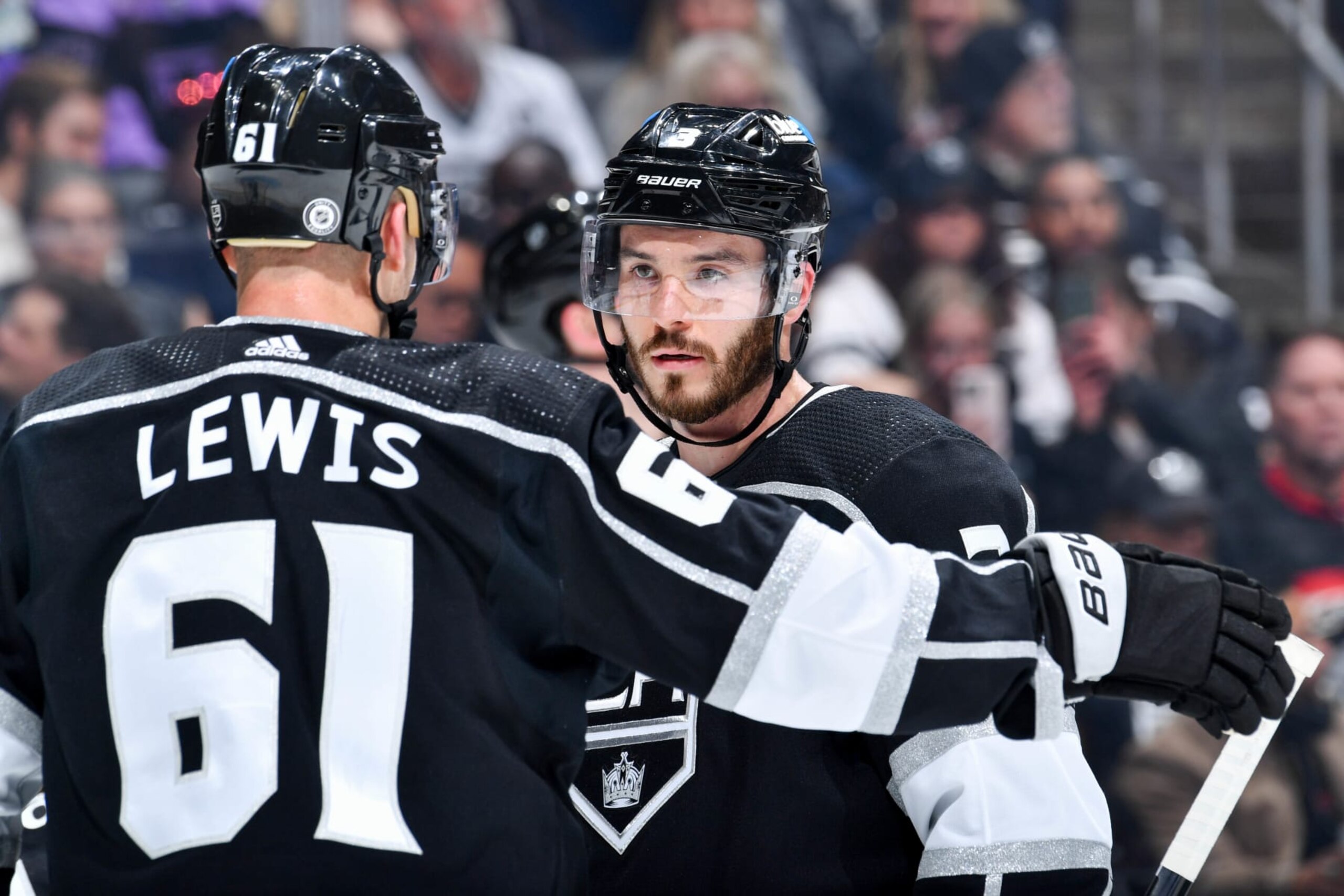 LOS ANGELES, CA - APRIL 18: Trevor Lewis #61 of the Los Angeles Kings and Matt Roy #3 meet on the ice during the second period against the Chicago Blackhawks at Crypto.com Arena on April 18, 2024 in Los Angeles, California. (Photo by Juan Ocampo/NHLI via Getty Images)