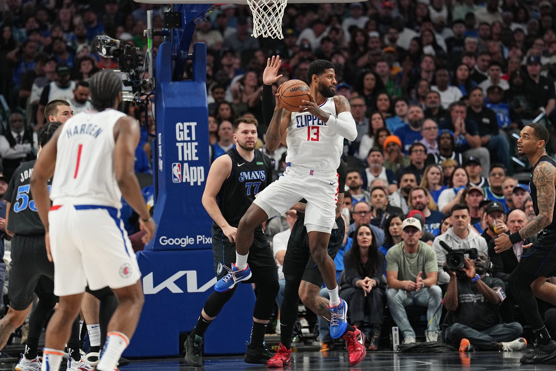 DALLAS, TX - MAY 3: Paul George #13 of the LA Clippers grabs a rebound during the game against the Dallas Mavericks during Round 1 Game 6 of the 2024 NBA Playoffs  on May 3, 2024  at the American Airlines Center in Dallas, Texas. NOTE TO USER: User expressly acknowledges and agrees that, by downloading and or using this photograph, User is consenting to the terms and conditions of the Getty Images License Agreement. Mandatory Copyright Notice: Copyright 2024 NBAE (Photo by Glenn James/NBAE via Getty Images)