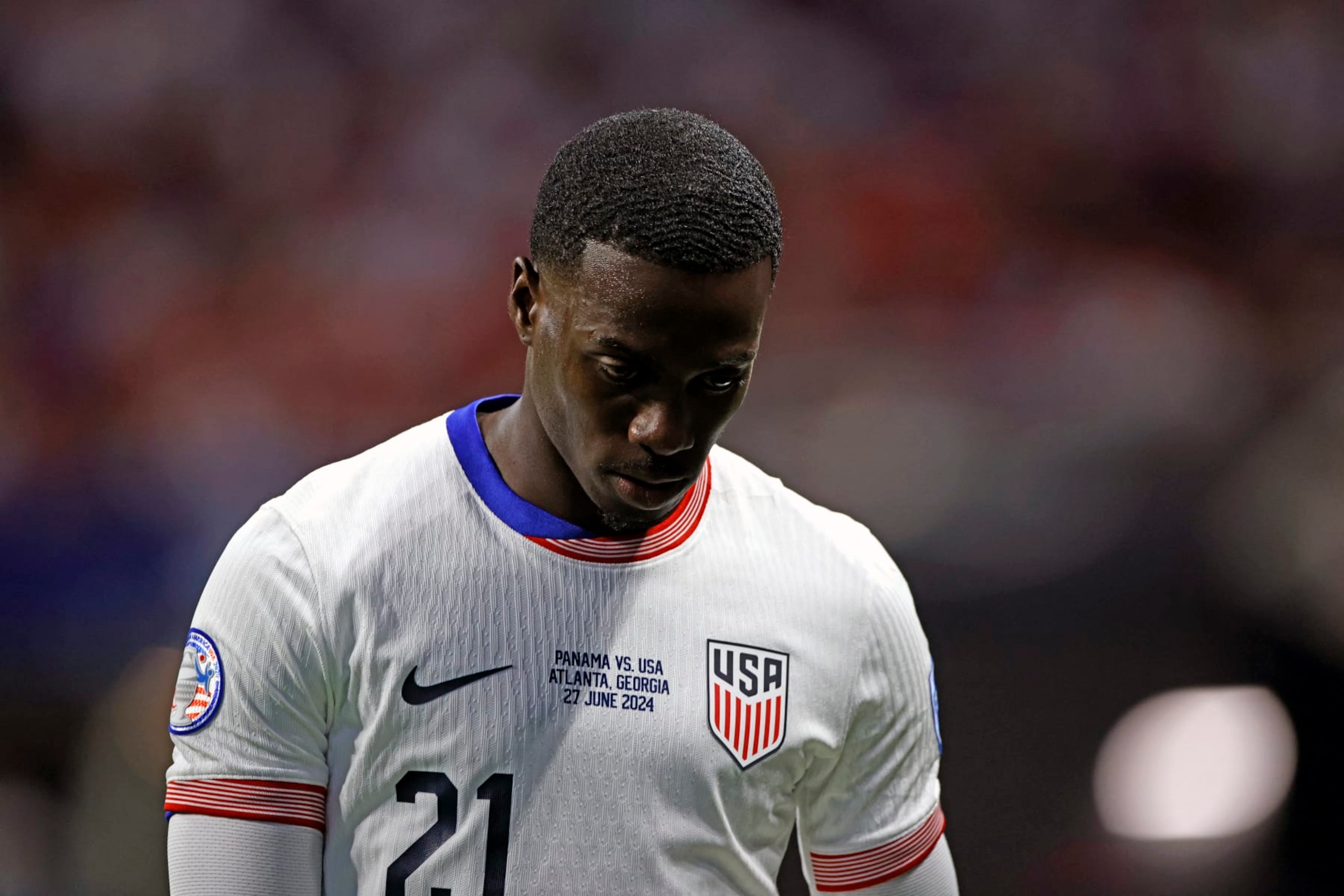 USA's forward #21 Tim Weah looks down as he leaves the pitch after being shown a red card during the Conmebol 2024 Copa America tournament group C football match between Panama and USA at Mercedes Benz Stadium in Atlanta, Georgia, on June 27, 2024. (Photo by EDUARDO MUNOZ / AFP) (Photo by EDUARDO MUNOZ/AFP via Getty Images)