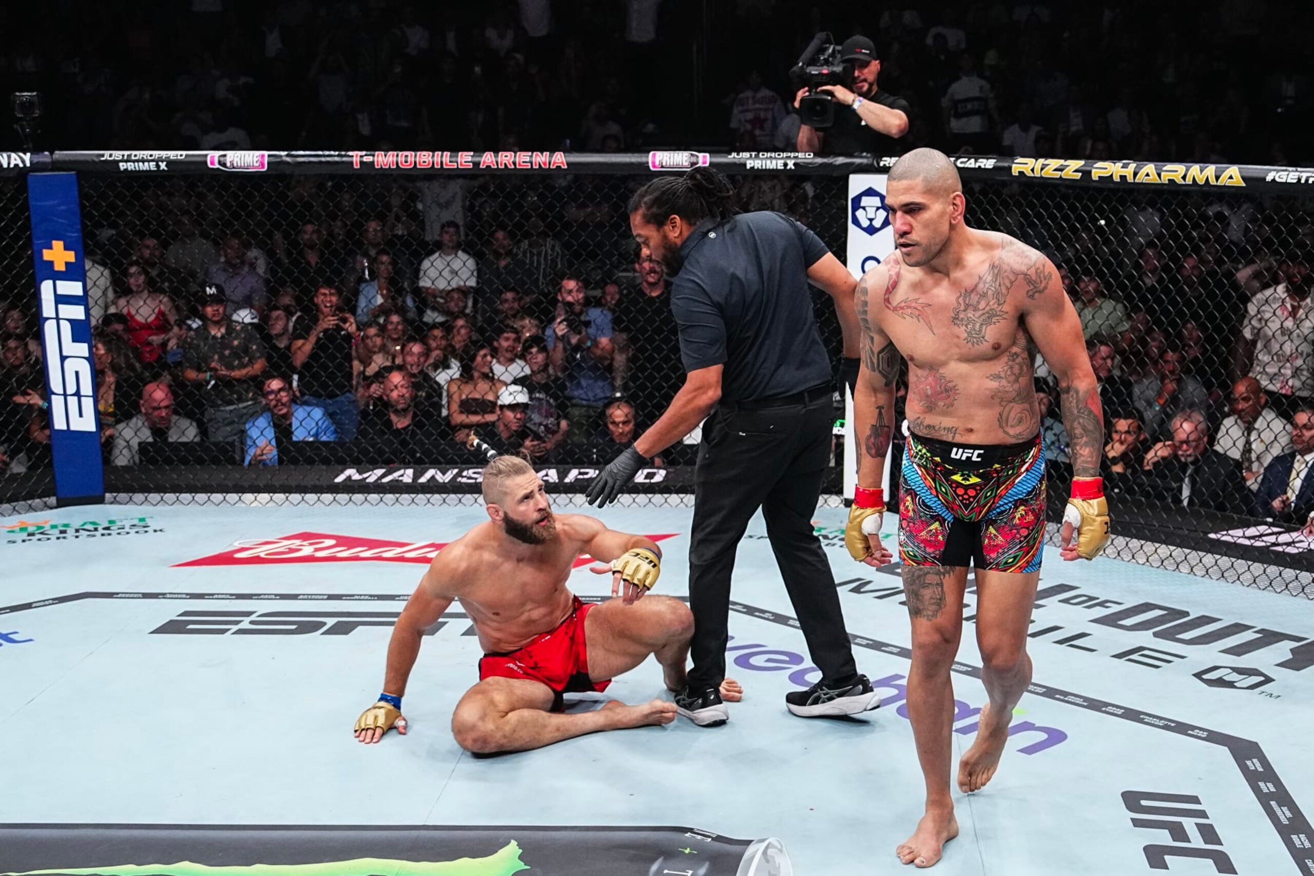 LAS VEGAS, NEVADA - JUNE 29: (R-L) Alex Pereira of Brazil reacts after knocking out Jiri Prochazka of the Czech Republic in the UFC light heavyweight championship fight during the UFC 303 event at T-Mobile Arena on June 29, 2024 in Las Vegas, Nevada. (Photo by Jeff Bottari/Zuffa LLC via Getty Images)